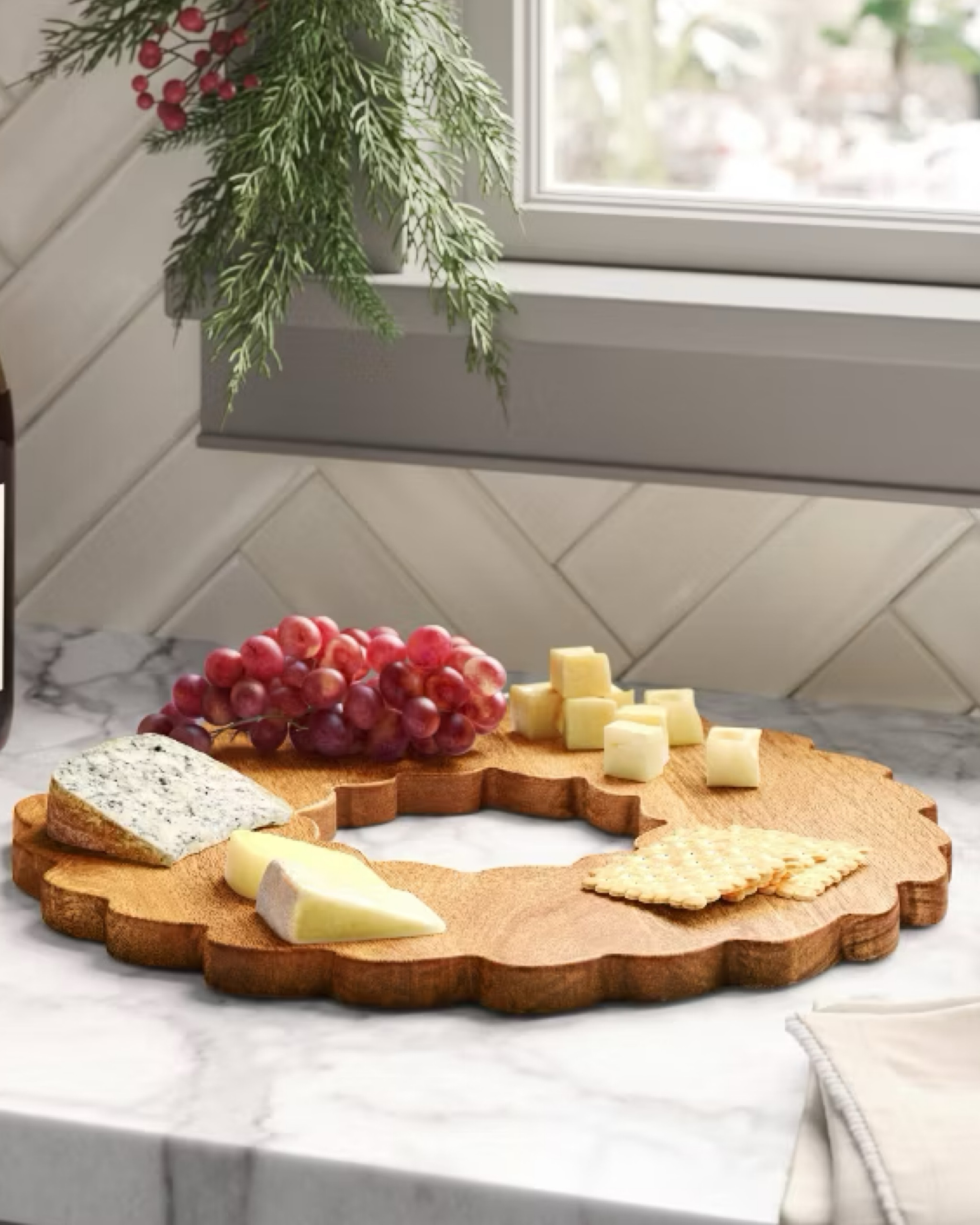 Elevate your holiday tablescape with the Wood Wreath Figural Serving Board. Thoughtfully crafted in the shape of a wreath with delicate scalloped edges, this 16.25-inch wooden board brings a warm, festive touch to any gathering. Its natural wood finish offers a timeless elegance, perfect for displaying appetizers, desserts, or seasonal treats. Ideal for the holidays yet versatile enough for year-round entertaining, this serving board effortlessly enhances your table with both style and function.

#LTKSeasonal #LTKHome #LTKParties