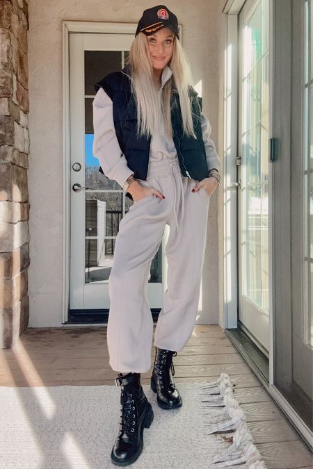 Abercrombie long sleeve one piece jumpsuit, Abercrombie black satin puffer vest, combat boots and nautical trucker hat 

#LTKfindsunder100 #LTKfindsunder50 #LTKsalealert