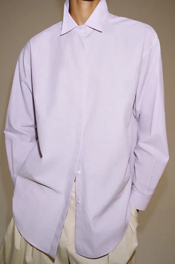 ZARA WOMAN COLLECTIONShirt made of a cotton blend yarn. Lapel collar and long cuffed sleeves. Rou... | Zara US