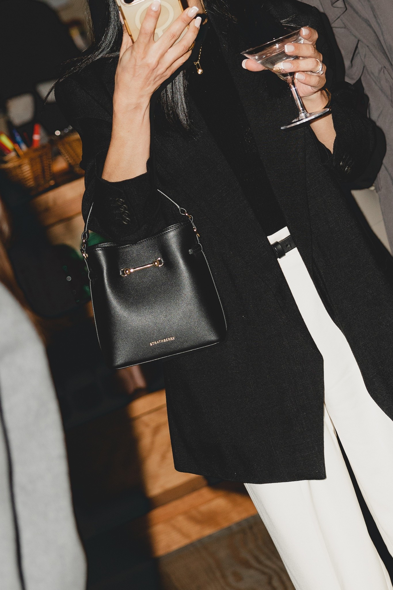 My new go-to black bucket bag from Strathberry. The Corda is a bucket-style silhouette, defined by a belt-inspired closure. Supple leather is drawn into shape through fine cord detailing, anchored by the signature Music Bar. The result is a silhouette that feels both structured and adaptive. #bucketbag #blackbag

#LTKOver40 #LTKootd #LTKWorkwear