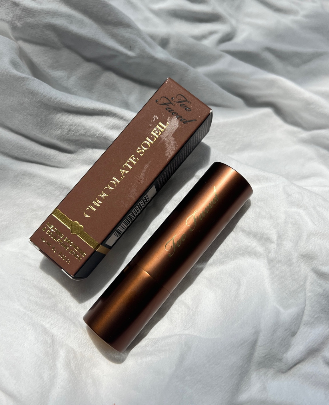 new cream bronzer stick from too faced - chocolate soleil melting bronzing and sculpting stick 

#LTKbeauty