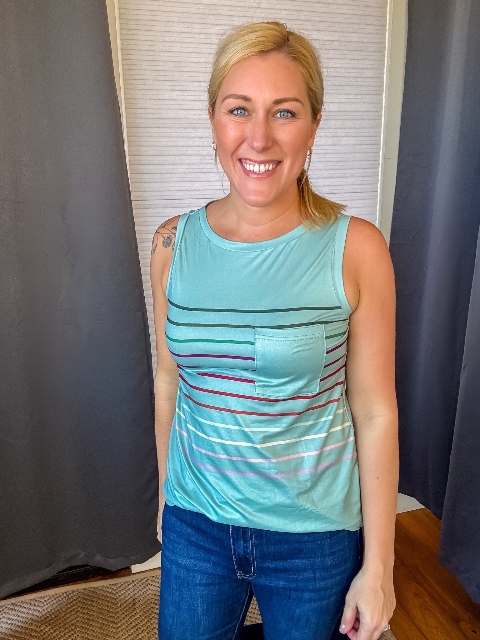 How cute are the colors and stripes on this sleeveless top?! The little pocket adds a nice touch as well.