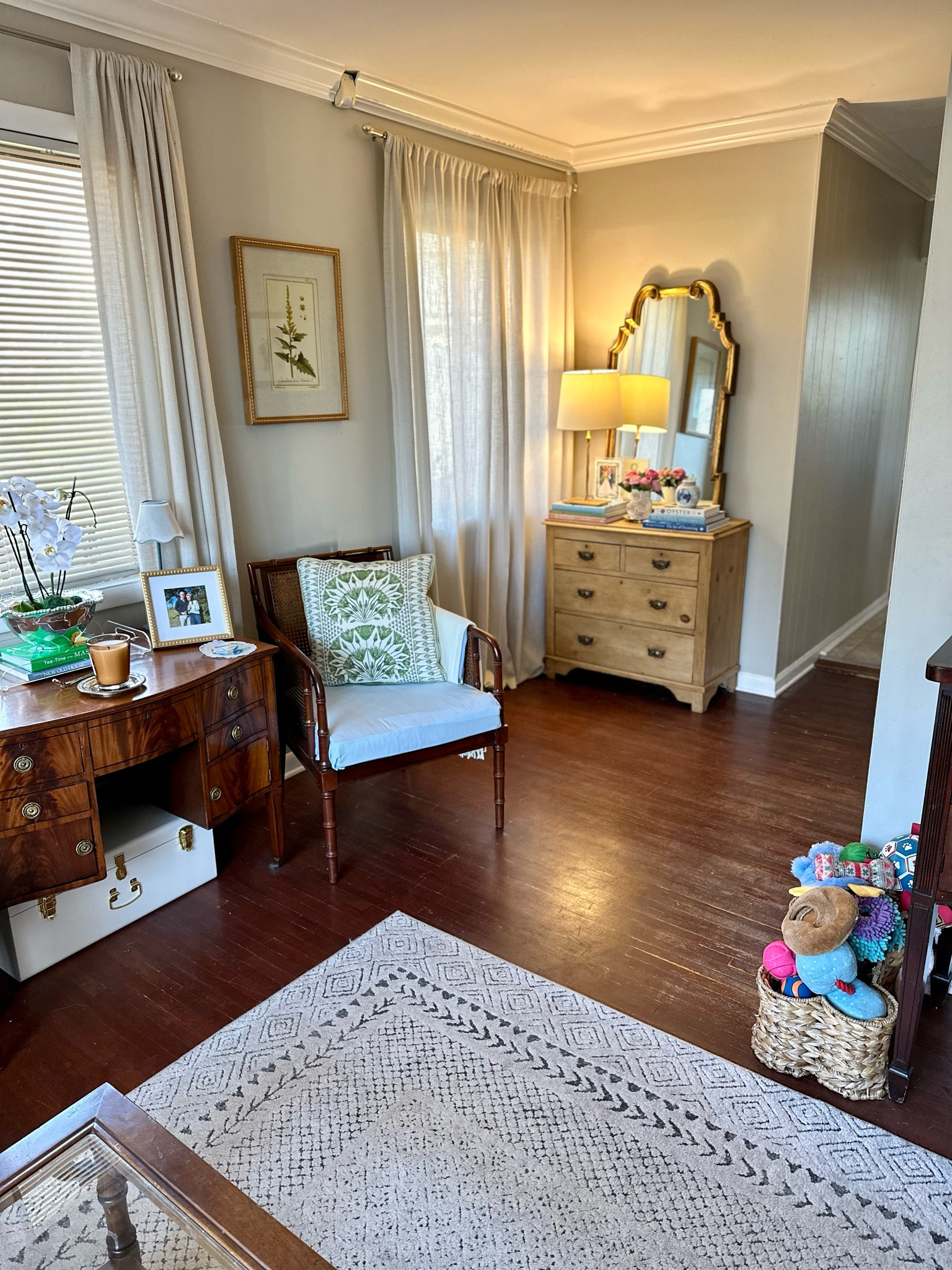 Mirror chest vignette that completes our living room space and leads to the hallway by our dining room! The mirror was an antique store find and the curtains were left by the previous owner  

Our living room so far feels pretty finished, but there are still some updates I’d like to make! Here’s a look at how it looks now to give you an idea of the space we’re working with and the different vignettes set up in the room!

First house, living room, blue and green decor, southern traditional, antique furniture, smaximalist, southern maximalism, affordable home decor, interior design hack, cane furniture, faux bamboo furniture, ikea sofa, skirted table

#LTKhome #LTKfindsunder100 #LTKfindsunder50