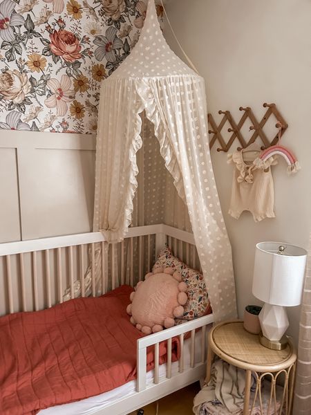 Nursery, neutral blush boho baby girl room! Toddler bedroom design idea. Baby girl play room 🤍 Babyletto Hudson crib convert to toddler bed, white and wooden. Beautiful cream polka dot canopy for little girl’s room. Toddler mattress topper. Target quilt and pillow. So comfy and beautiful! 

#LTKfamily #LTKbaby #LTKkids