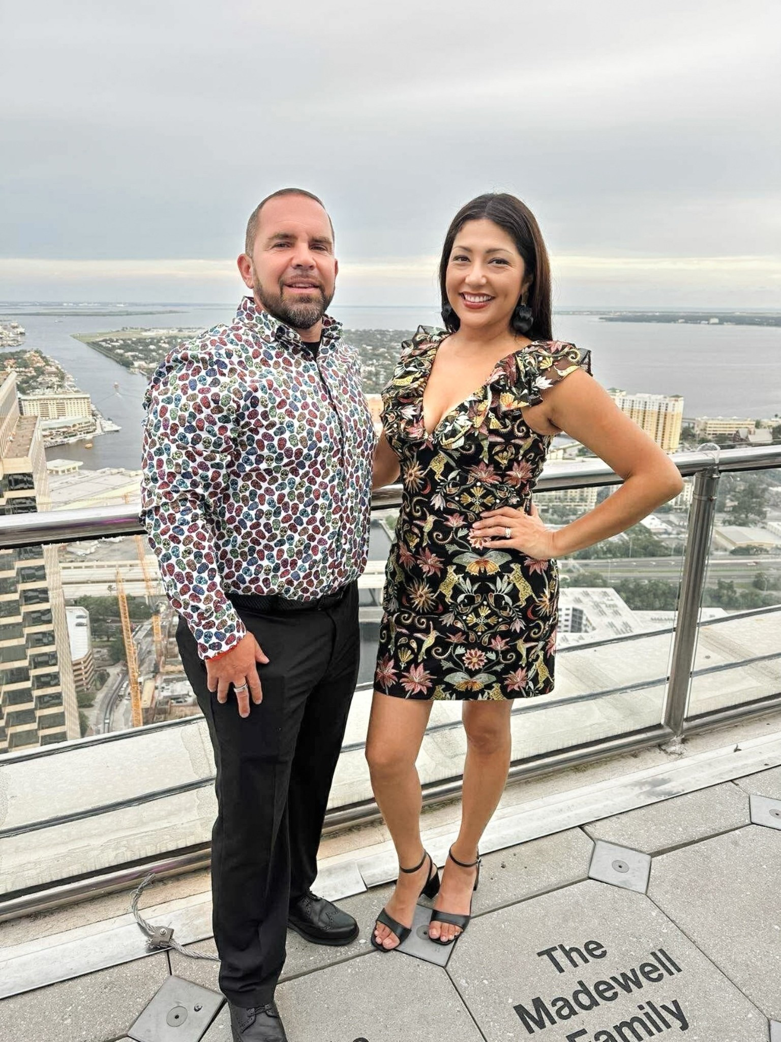 Moody skyline, bold florals 🌸✨
This dress is perfect for dinner, events, or a night in the city. The embroidered florals pop against the black mesh, and those ruffle shoulders? Just the right amount of drama.

Doug matched my vibe in his Multi-Color Skull Print Shirt — the perfect mix of bold and fun for date night.

Finished with my ride-or-die Antonio Melani heels (yep, own them in nude and black) — because at this stage, I refuse to choose between style and comfort.

#DateNight #MidlifeStyle #FloralDress #SpecialOccasion #CouplesStyle #HisAndHersStyle #Dillards


#LTKSeasonal #LTKShoeCrush #LTKOver40