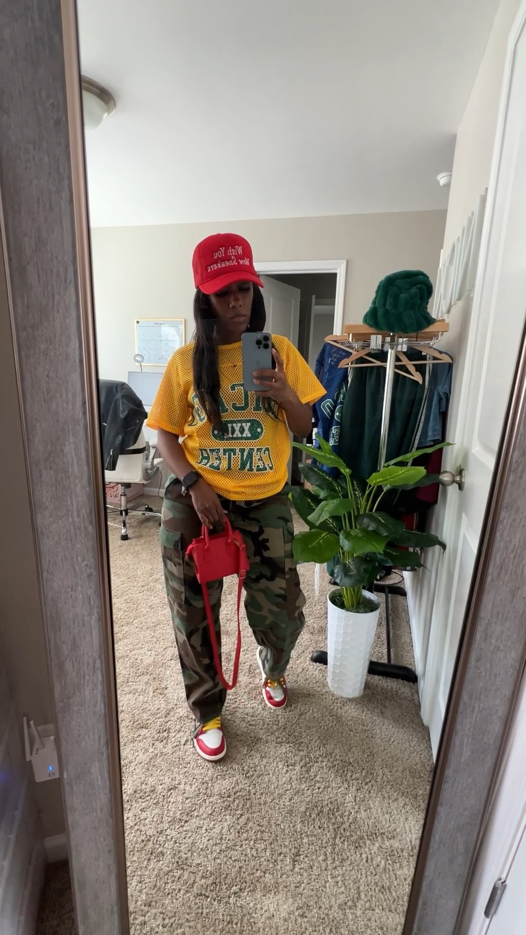 How to style camo pants with a yellow jersey shirt. I pairs this casual outfit with a red trucker hat, red purse, and Jordan 1 Teyana Taylor sneakers

#LTKShoeCrush #LTKStyleTip #LTKFindsUnder100