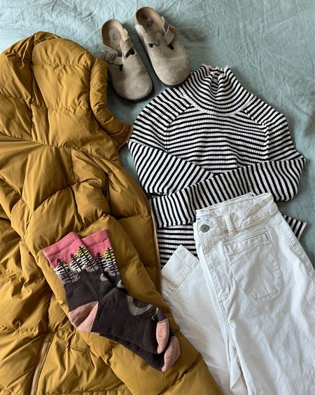 Earthy granola girl style with Birkenstock taupe clogs, white wide leg pants, wool socks, and a camel parka jacket. Striped turtleneck tee is a great Target find!! So soft ☺️ 

#LTKfindsunder100 #LTKstyletip #LTKtravel