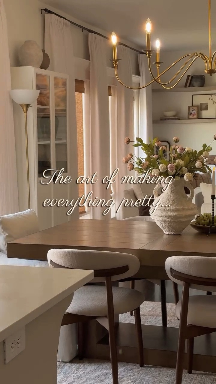 Part 2 of my dining room makeover 🌿🌷 
I was dreaming this look for a long time...Styling my dining room with upholstery chairs with an arched back and warm wood accent, adding accent chairs for a cozy dining nook look and a sexy curvy chandelier above 😮‍💨. I love the french-y look on here. Finishing the styling with an abundant bundle of beautiful peonies and seasonal touches. 🌷🌿🤎

Comment SHOP for the links to this post! 🤎 
. 
.
.
.
.
.
#homedesign #homestyling #homestyle #springdecor #homedecoration