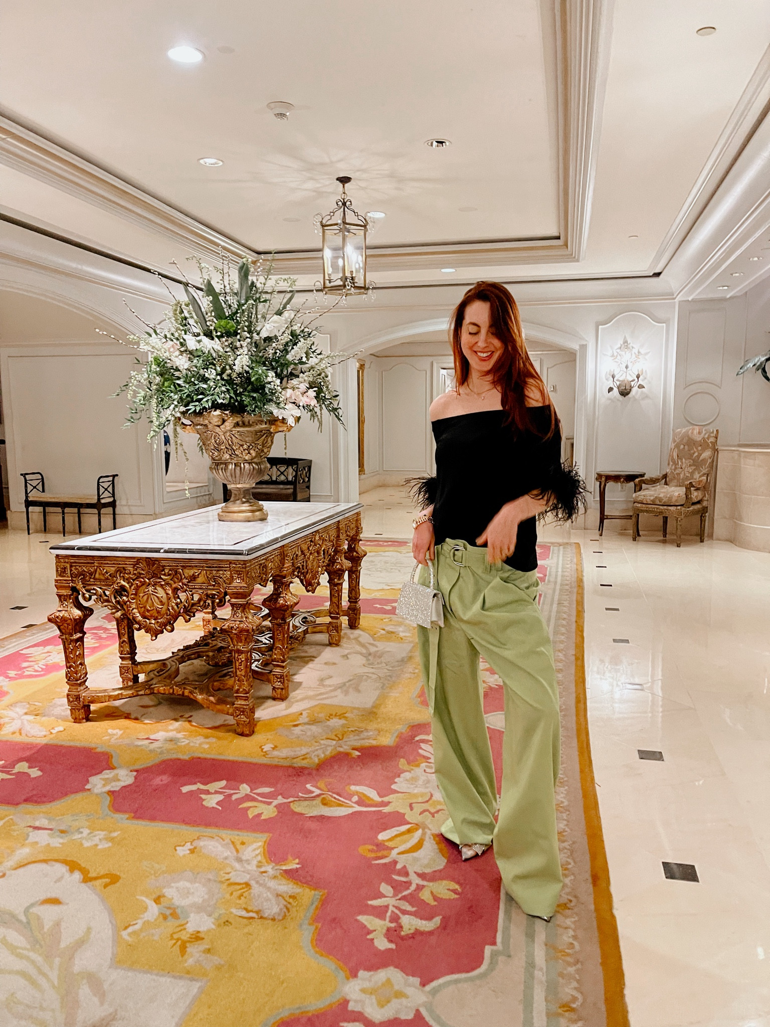 I love this off the shoulder feather trim top from Tuckernuck, wearing a size small. Went three sizes up in the pants for a looser fit. Loving this rhinestone mini bag from Steve Madden and these rhinestone heels from Express. #trouser #workwear 

#LTKstyletip #LTKworkwear