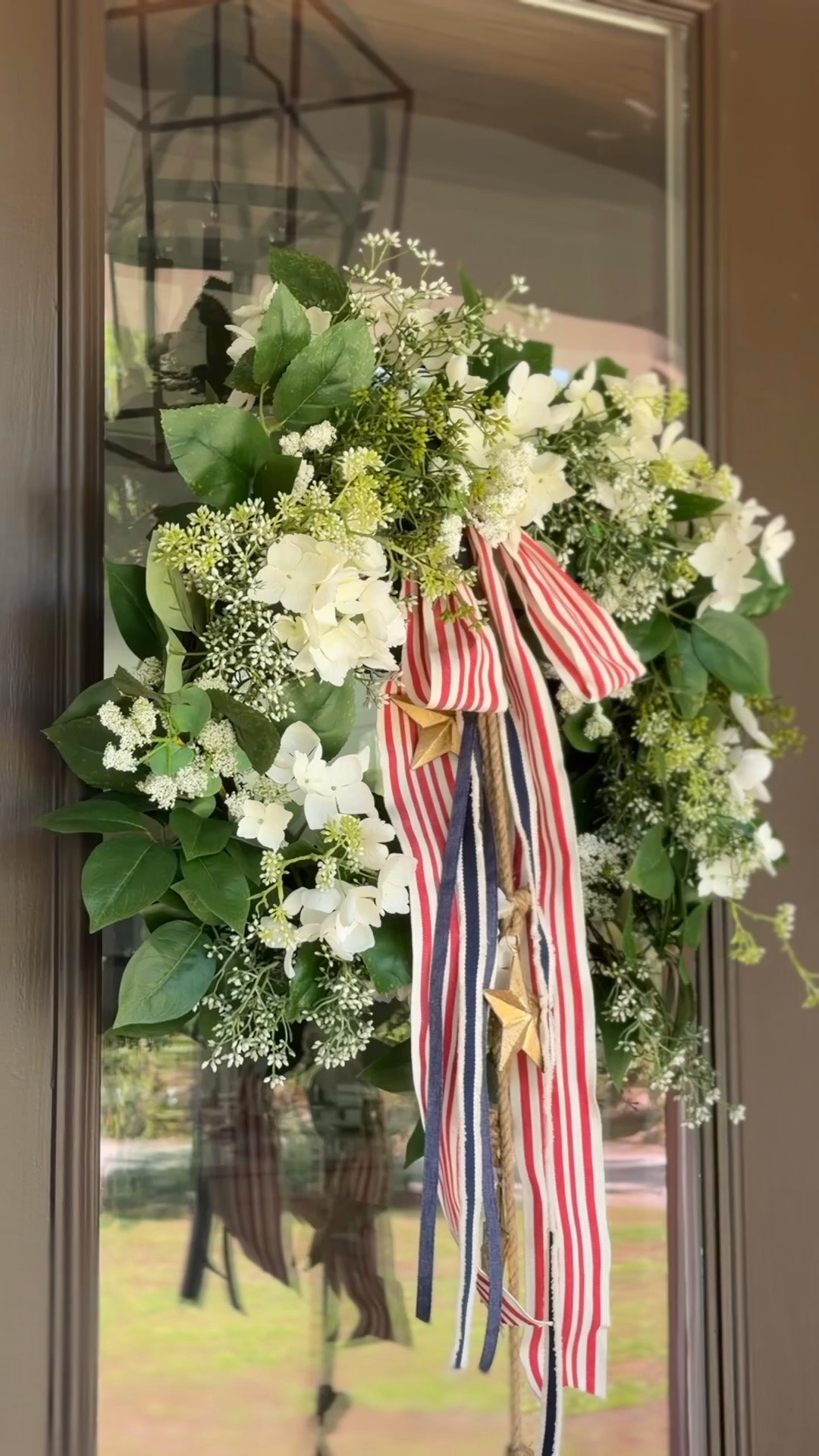 Fourth of July wreath 🇺🇸 Took my favorite Target wreath and added some additional florals, ribbon, and these festive aged brass stars ⭐️

Front porch, front door

#LTKSeasonal #LTKHome #LTKSaleAlert