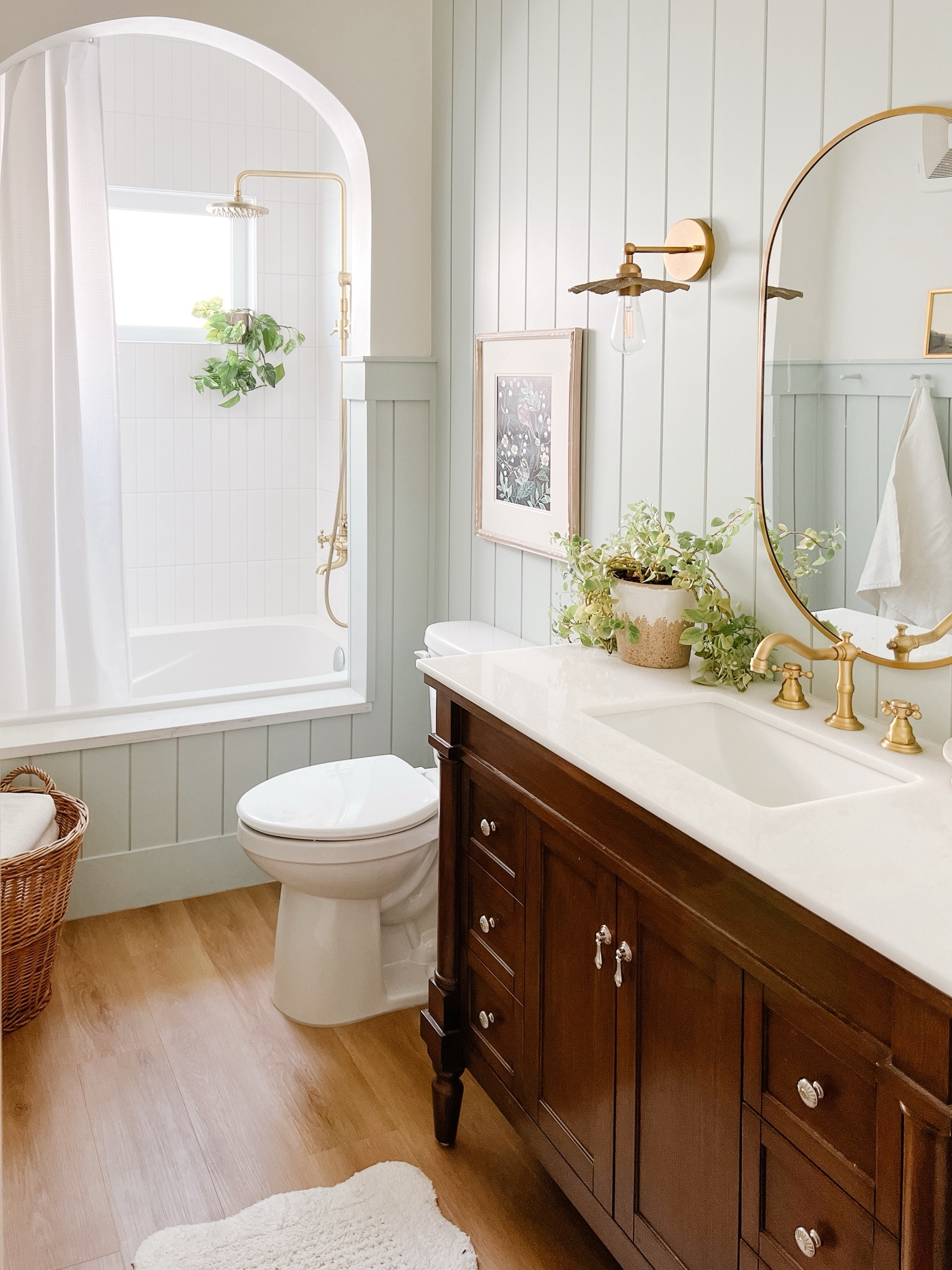 Boho cottage bathroom with shiplap and arched bathtub 

#LTKhome #LTKSpringSale #LTKsalealert