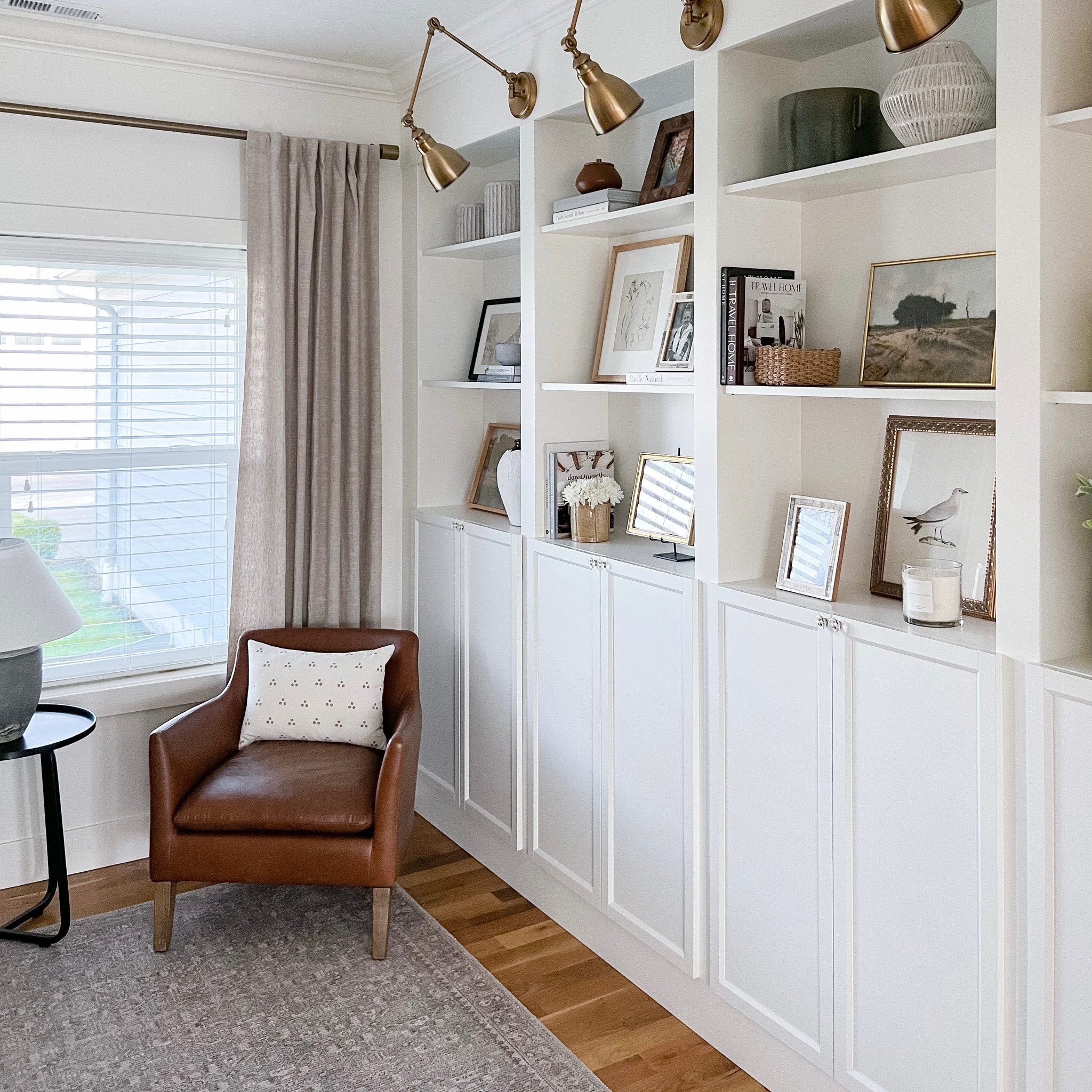 This side of my home office includes a Pottery Barn Spear leather chair and a black side table and Loloi area rug  

#LTKFind #LTKhome #LTKstyletip