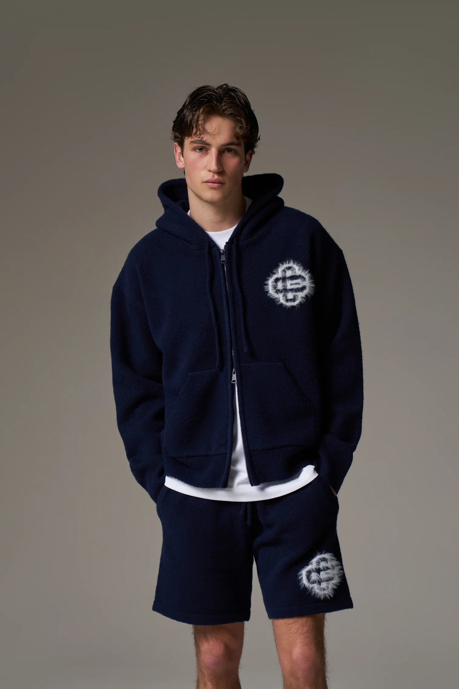 FLUFFY EMBLEM ZIP THROUGH KNITTED HOODIE - NAVY | The Couture Club