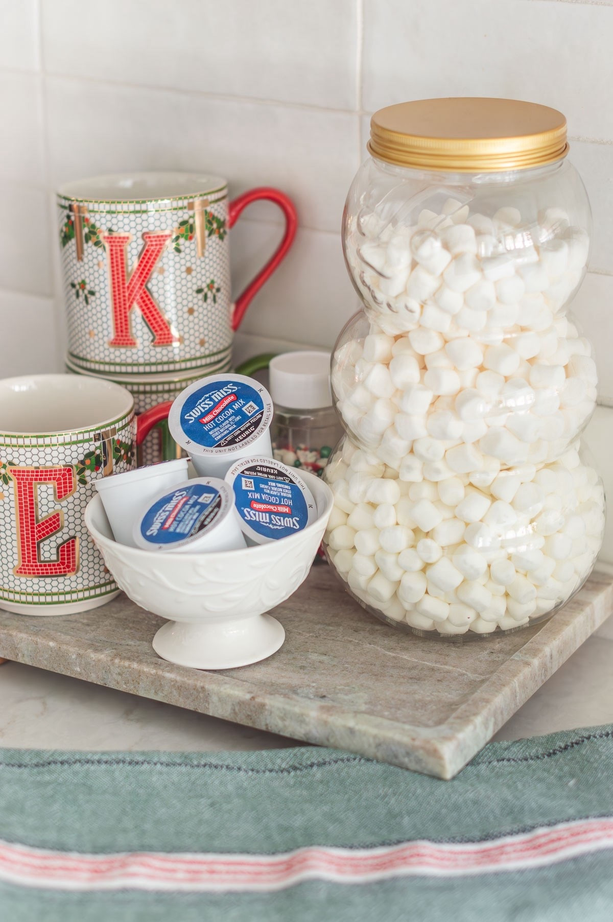 Eliza is a FIEND for hot cocoa and I wanted her to be able to make her own cups. So, I created a simple little station and stocked it for her with the essentials. The snowman jar is plastic so I can rest easy on that, too. hot cocoa station hot chocolate kitchen decor Christmas decor monogram mugs Christmas mug Christmas dish towel

#LTKHoliday #LTKFindsUnder50 #LTKHome