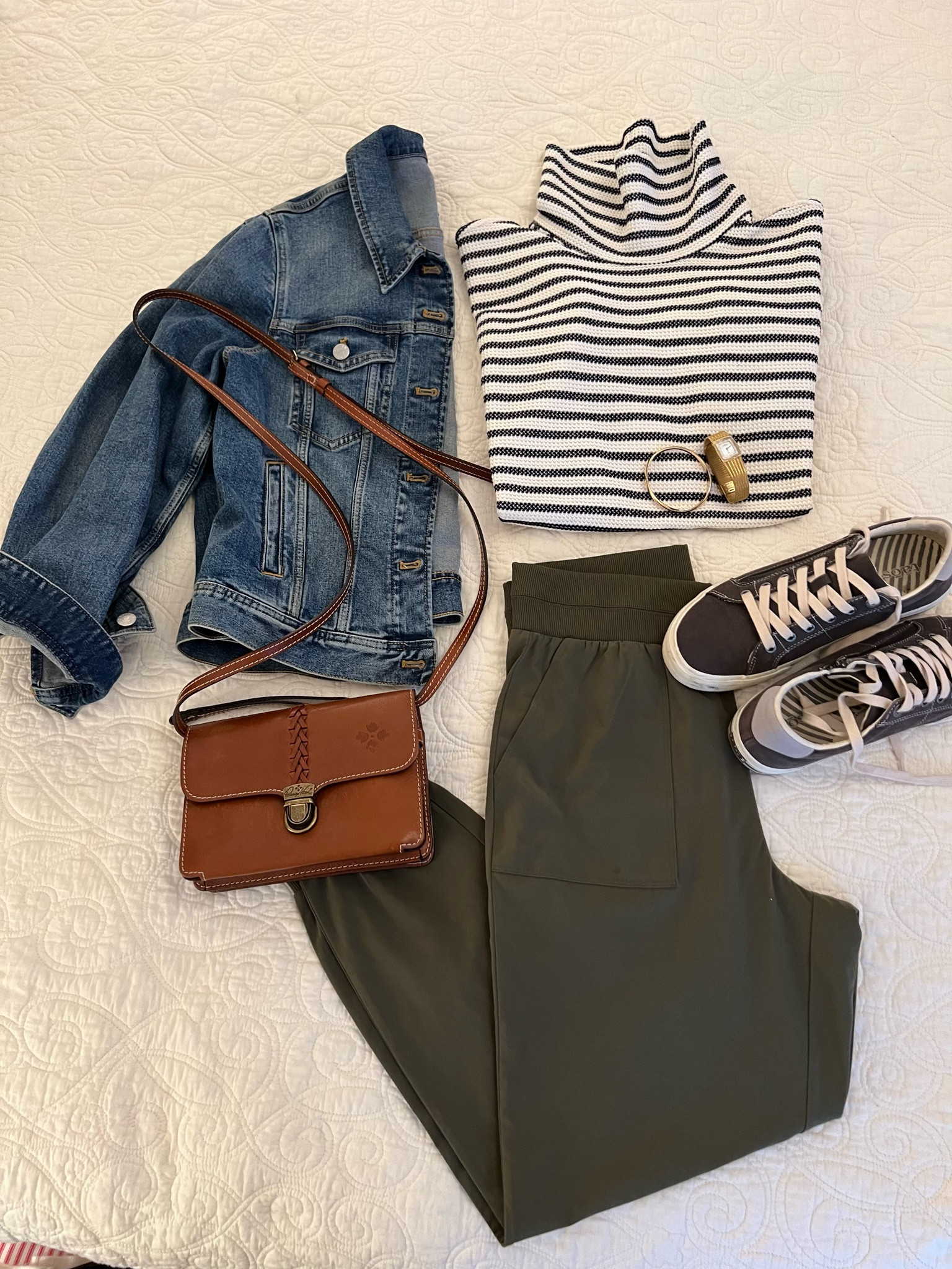 If you love stripes and joggers, you will adore this easy travel outfit! These pieces pair like peanut butter and jelly! This oversized striped turtleneck is cute just with the olive joggers by day. And when it’s a bit cooler, pop on the jean jacket and brown crossbody. The grey @taos sneakers look so sharp with the olive joggers. And the hold jewelry finishes off the fun casual fall 🍁getaway look.

#LTKTravel #LTKOver40 #LTKSeasonal