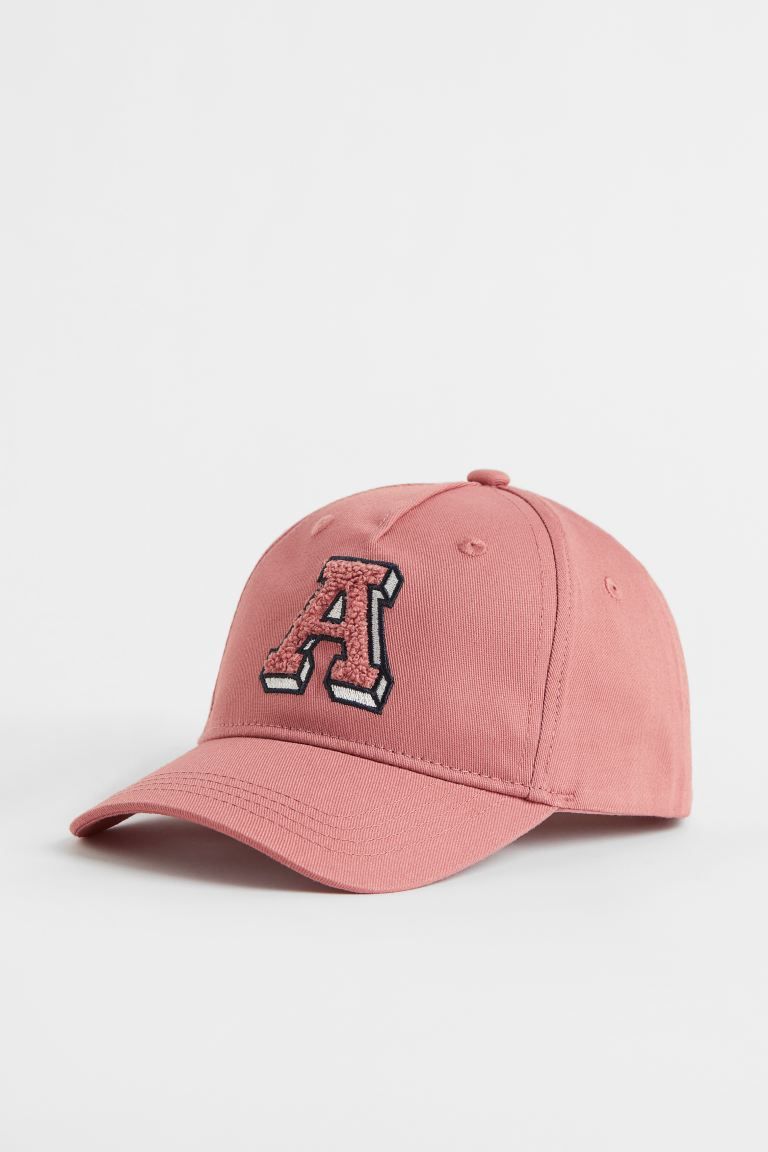 New ArrivalCap in cotton twill with a covered button at top and adjustable plastic fastener at ba... | H&M (US + CA)