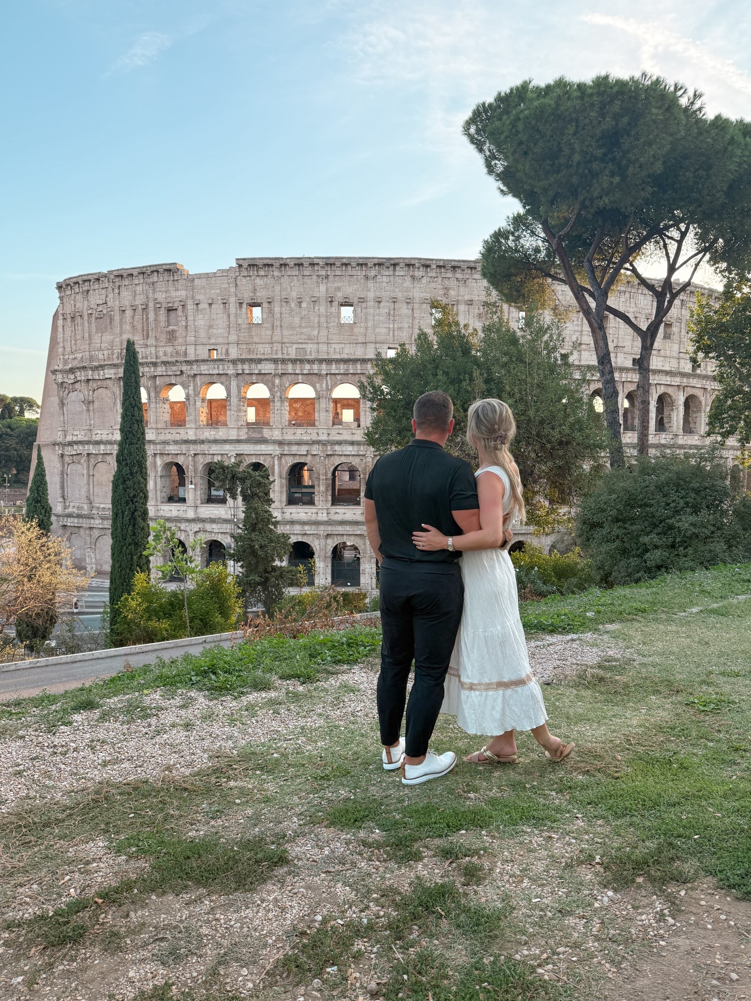 This is your sign to catch the sunset in Rome during your honeymoon! We kept it classic for our date night by the Colosseum — a white midi dress for me, a black button-down for Richie — simple pieces that always photograph beautifully against the city’s golden glow. If you’re planning an Italy honeymoon, outfits that feel effortless and elevated are the way to go. Think neutrals, clean lines, & timeless silhouettes you’ll love in every photo 10 years from now. Save this for your Rome honeymoon style planning & follow @kitchensinkit for more Europe travel outfits. Rome honeymoon outfits, Italy honeymoon fashion, Europe honeymoon outfits, white dress Italy honeymoon, black button-down men’s outfit Italy, couples honeymoon outfits Europe, Colosseum date night outfits, chic Europe travel style, honeymoon fashion inspiration Italy, black & white couples style, romantic date night outfits Rome, luxury honeymoon outfit ideas Europe, timeless honeymoon fashion, elegant honeymoon outfits Italy, Rome couples style outfits

 

 

#LTKTravel #LTKMens #LTKWedding