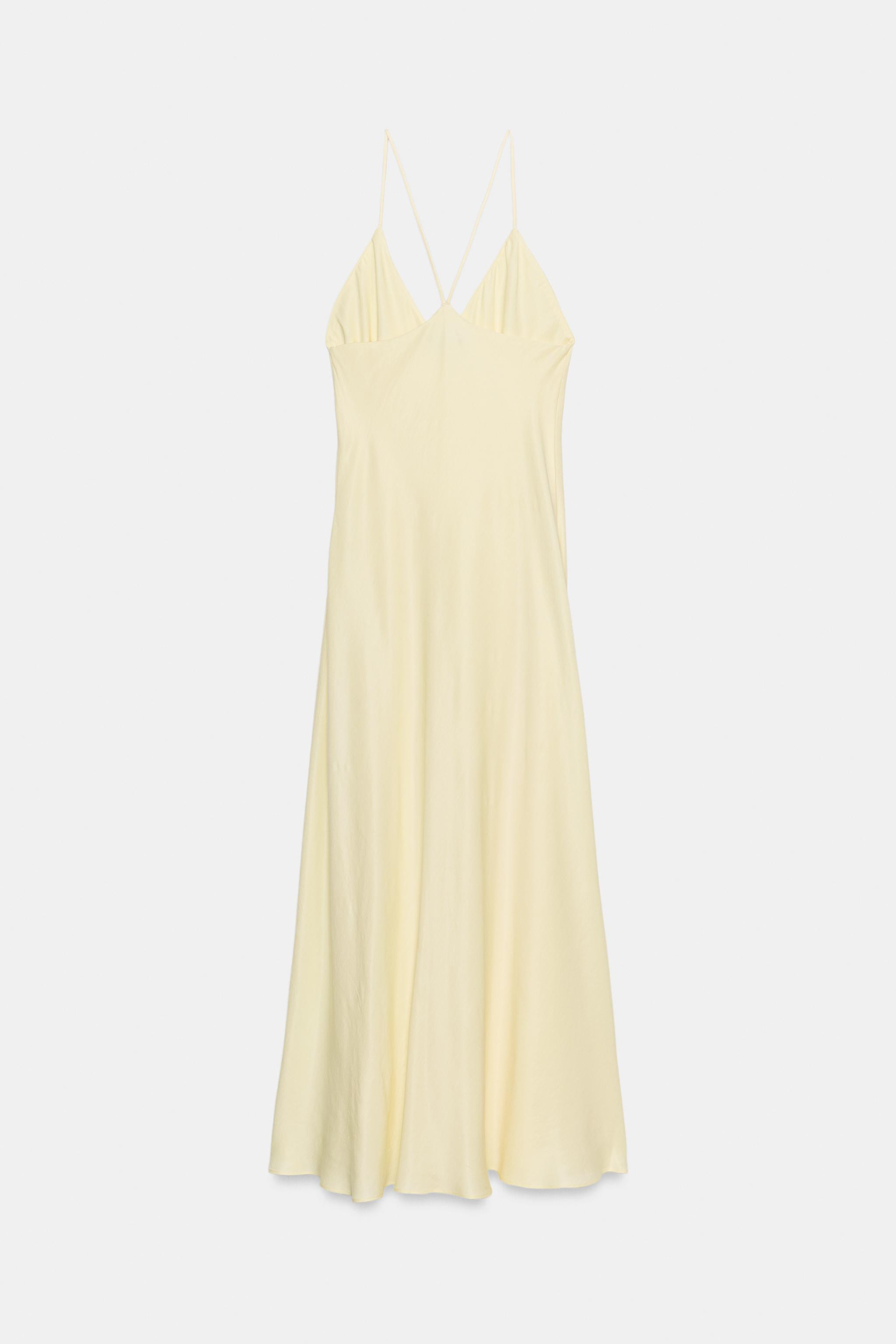 ZARA WOMAN COLLECTIONDress made from a viscose blend yarn. Featuring a V-neck and thin straps. A-... | Zara UK