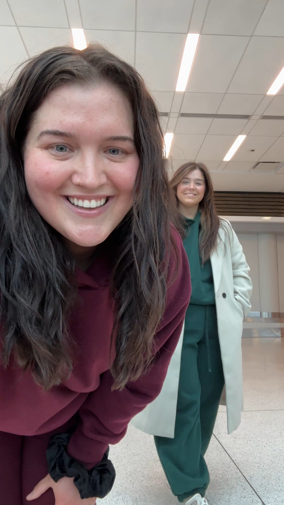 Comfy travel outfits for NYC ✈️ Matching jogging lounge sweat suits. Bestie layered it with a trench coat which is the perfect layer for the Winter 🧥 
I’m wearing an XXL in set + Kahley is wearing a XL. Aerie cozy fleece lined joggers, hoodie and sneakers. 

#LTKPlusSize #LTKTravel #LTKootd