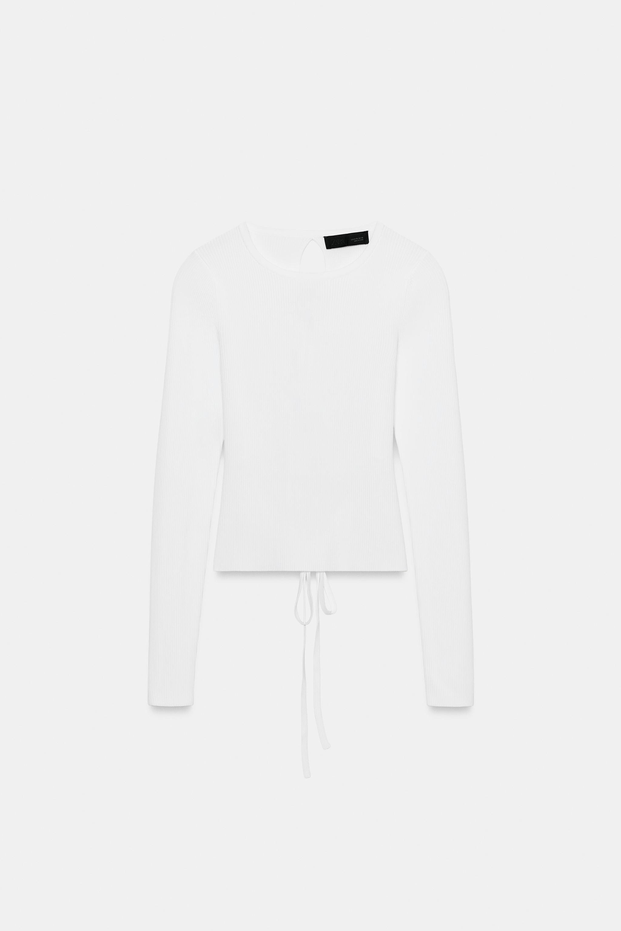 Round neck long sleeve top. Open back detail with metallic beads and tie. | Zara US