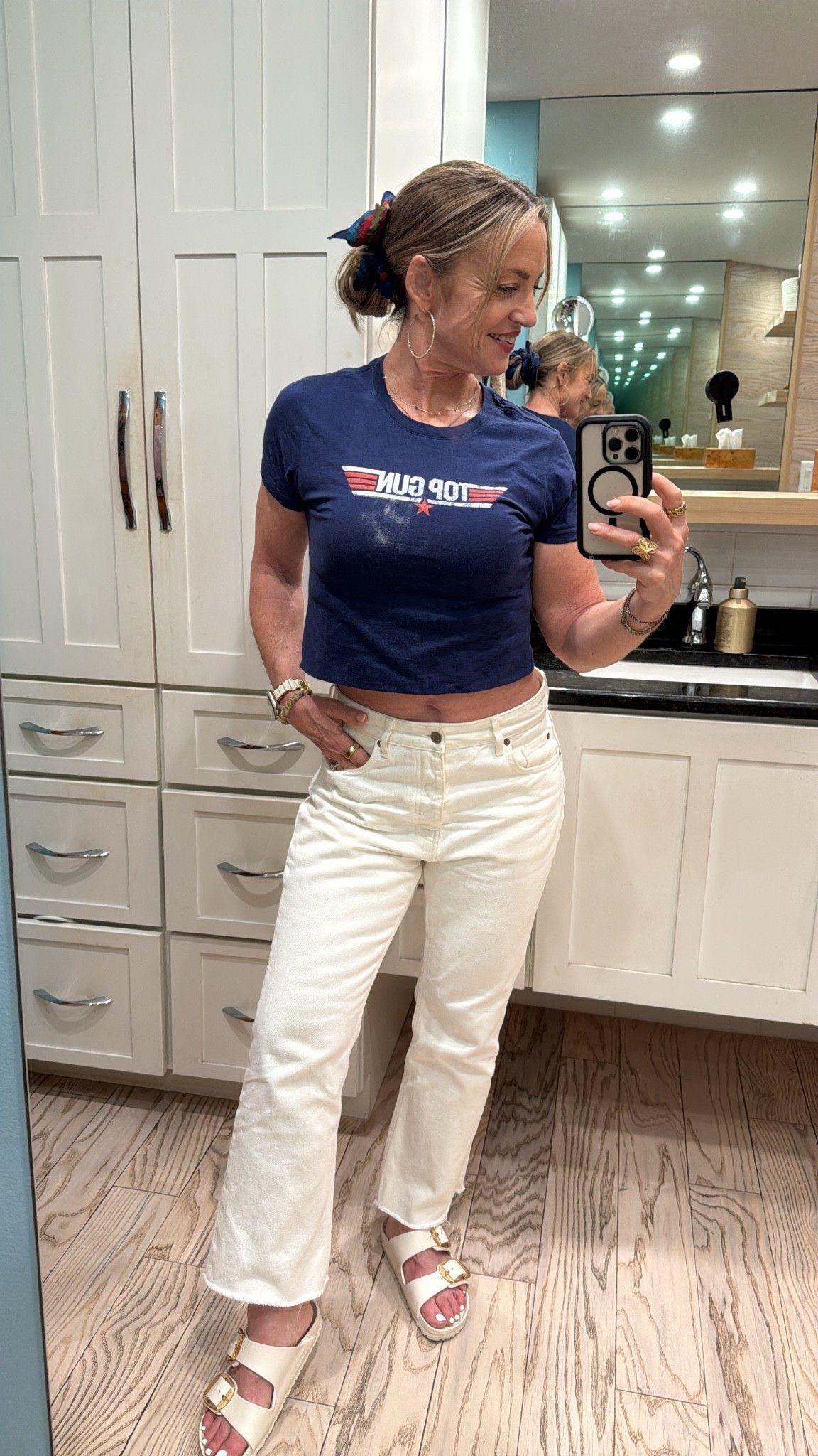 4th Fit channeling the 80s with a Top Gun Tee, white kick flick jeans and Birks

#LTKSeasonal #LTKOver40 #LTKootd
