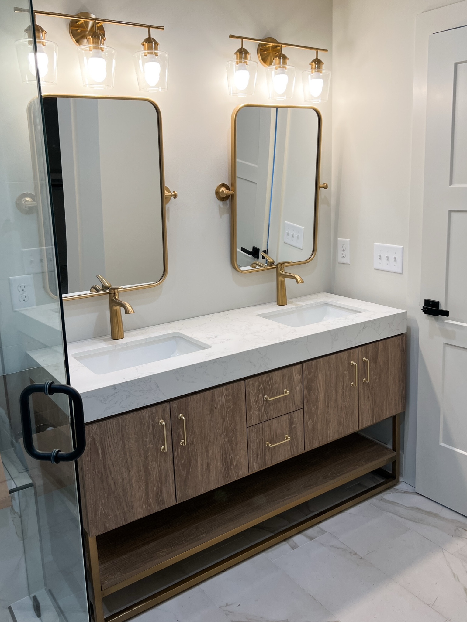 Modern bathroom design with gold accents.

#LTKHome