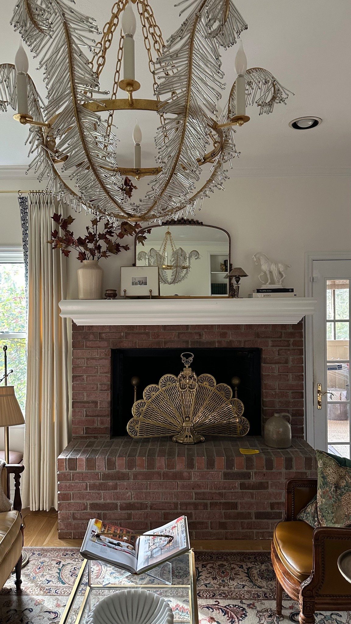 The living room decor is always evolving!  The new Calais Chandelier I just hung is such a showstopper and I still can't believe I found this on FBMP. I'm thinking of swapping out the mirror above the fireplace for some artwork like what I have tagged here. My fireplace mantel styling ideas are always evolving and it's fun to mix things up! I’m loving how the new curtains compliment the entire room. #livingroom #livingroomdecor #mantelstyling #fireplaceideas #interiordesign #luxurylighting  

 

#LTKStyleTip #LTKHome #LTKFindsUnder50