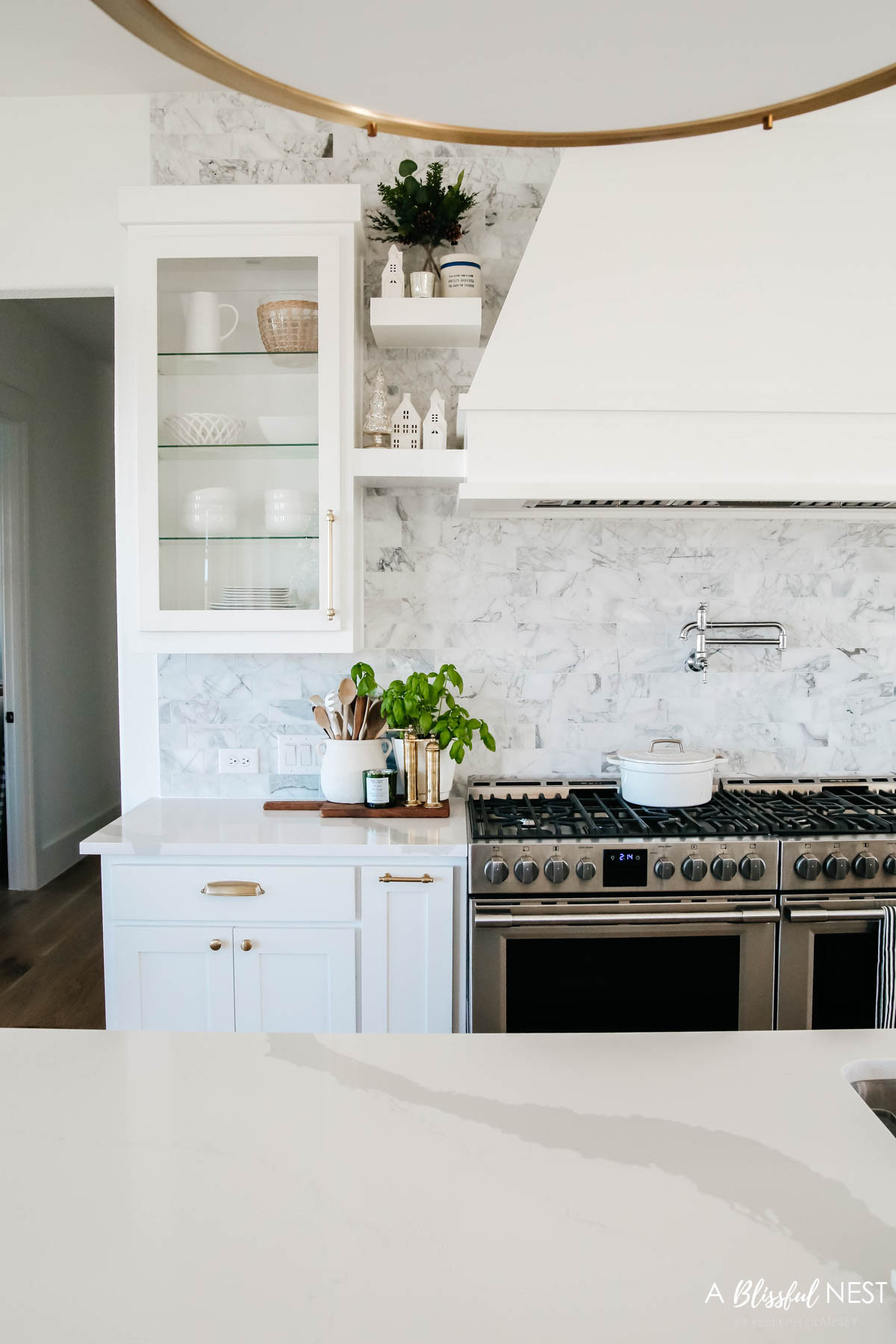 This Christmas kitchen felt warm, inviting, and full of simple holiday cheer. Shop the festive details here.
European mill, Mud Pie utensil holder, wooden spoons, blueberry greenery pick, Christmas village houses 

 #LTKHoliday #LTKSeasonal #LTKHome