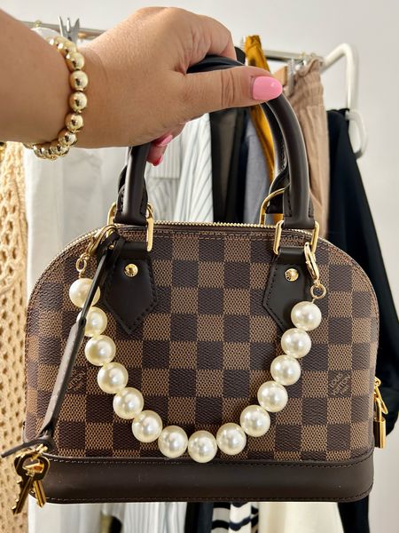 Louis Vuitton Palm Springs
Faux pearl bag accessory 

#LTKover40 #LTKstyletip #LTKitbag