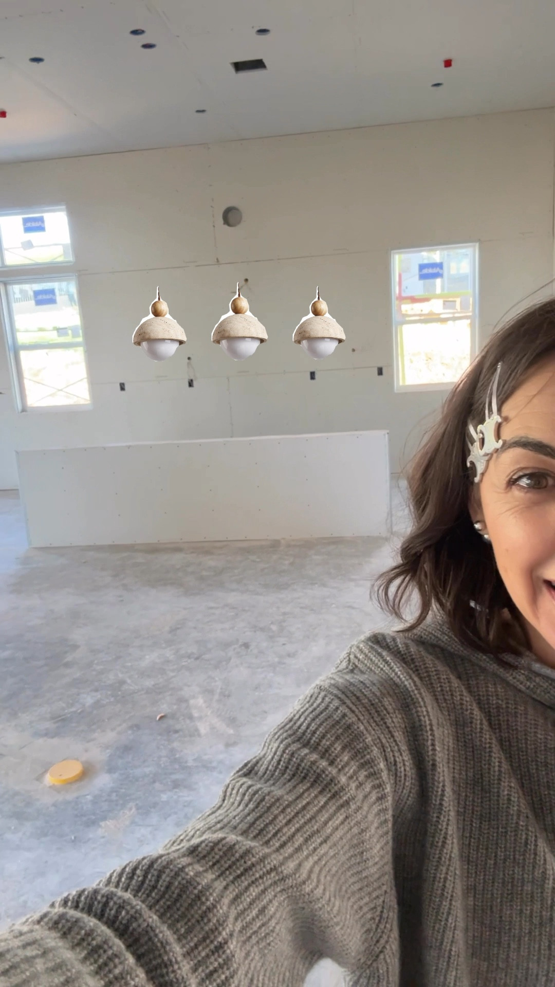 We’ve always wanted a single story open floor plan. For the first time we’ll have an island. It’s prewired for pendants. Help me decide how to warm up this space to give it a “soft” Spanish influence. My cabinets are white, floors will be wood, and counter tops a milky quartz. My fixtures are matte black so I’m thinking think black pulls and lots of clay and wood textile accents.