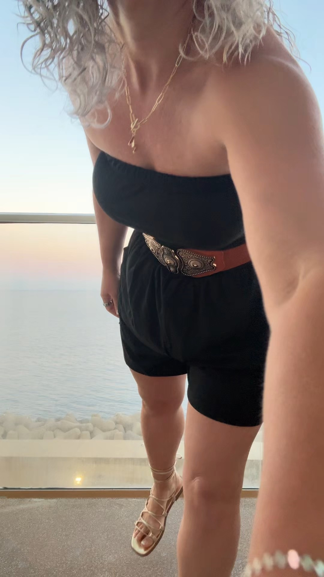 Vacation mode: ON 🖤✨
Easy, breezy, and just the right amount of extra in this black romper, vintage belt, gladiator sandals & a cute initial necklace. Effortless style for sunny days! ☀️✈️ #LTKtravel #vacationoutfit #effortlessstyle #romperseason #LTKfashion