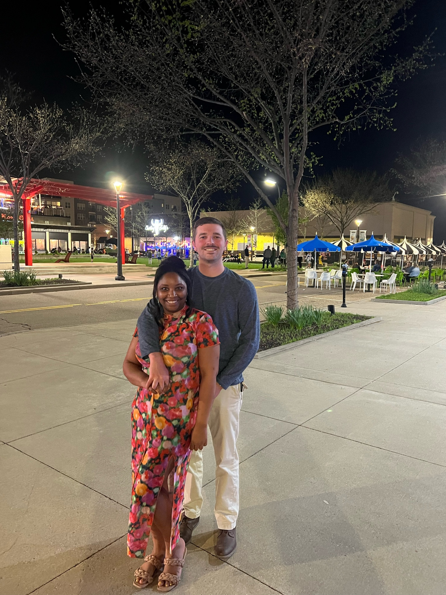 Floral mesh dress, green earrings and tan sandals 