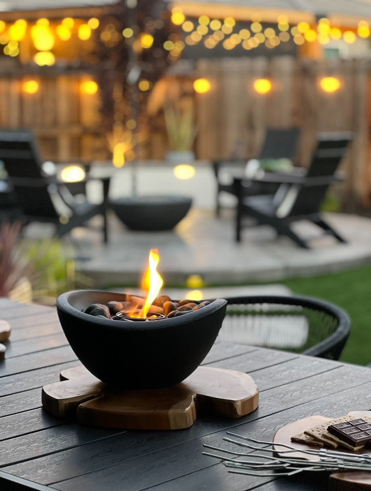 Black and white backyard furniture, black backyard dining set, fire pit, firepit area, Adirondack chairs, fire bowl, alfresco dining, black pergola, backyard oasis

#LTKSeasonal #LTKHome