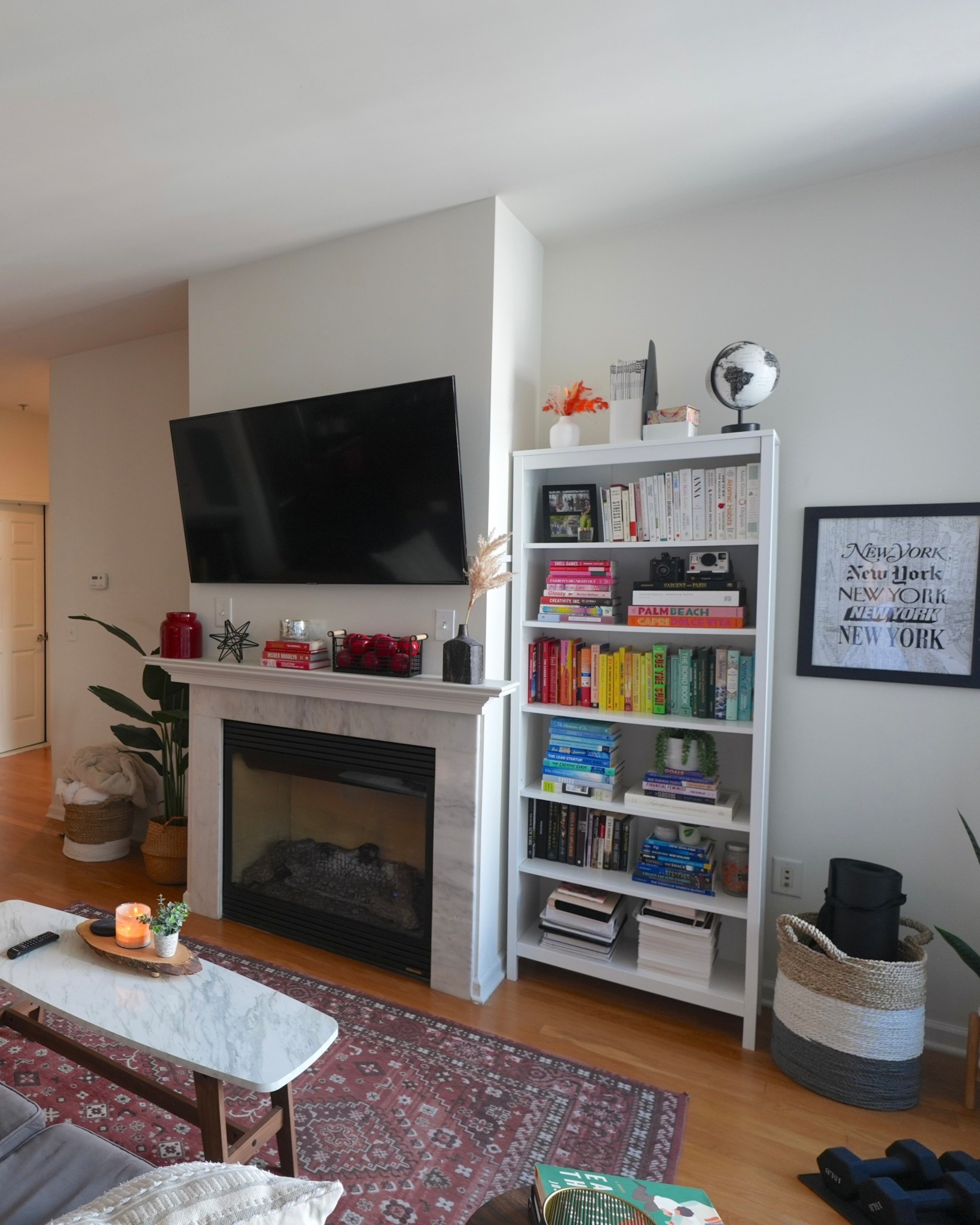 This is our main living space where we spend most evenings. Our gray sectional sofa is super comfortable and pairs perfectly with a patterned rug that ties the whole room together. The bookshelf are my favorite feature — perfect for displaying books, candles, and little decor pieces.

#LTKHome #LTKFindsUnder100