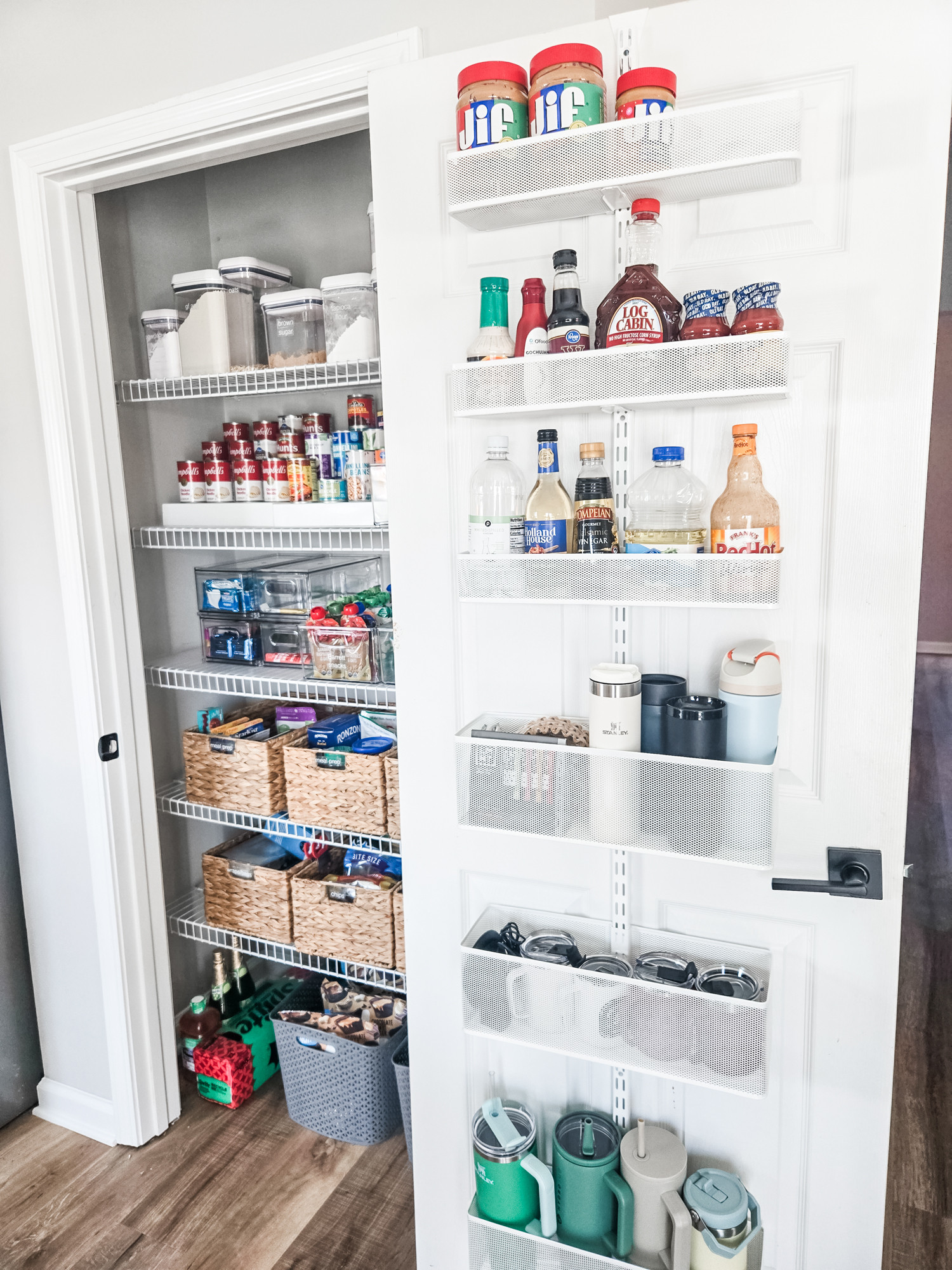 Check out this Elfa door system - the amount of space is adds to this small pantry is incredible! We'll handle all the measuring, ordering, installing, and organizing so let us know if your space needs this. 

 