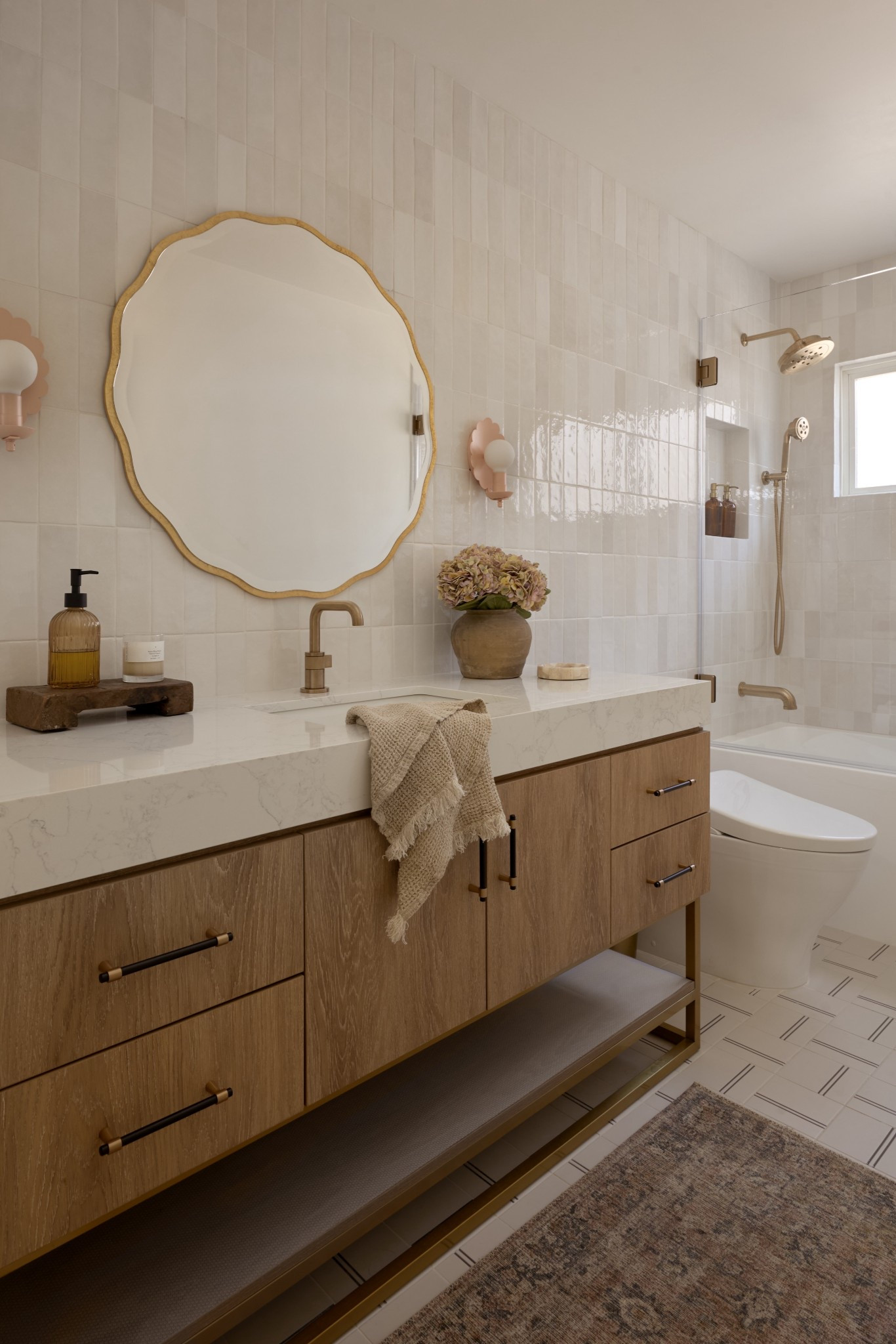 This vanity looks so custom and saved our clients so much $$$$. Anytime you can buy a vanity with a countertop you’ll save thousands since you don’t have to buy a countertop plus pay for fabrication. Several are on sale for Black Friday!

 Wood vanity oval capsule, mirror, rectangle, mirror, medicine cabinet, brass faucets, brass hardware, bra, shower system, white soaking tub bra, sconces, bubble chandelier, bathroom, accessories, white tile, gray tile marble tile sink rug runner

#LTKFindsUnder100 #LTKSaleAlert #LTKHome