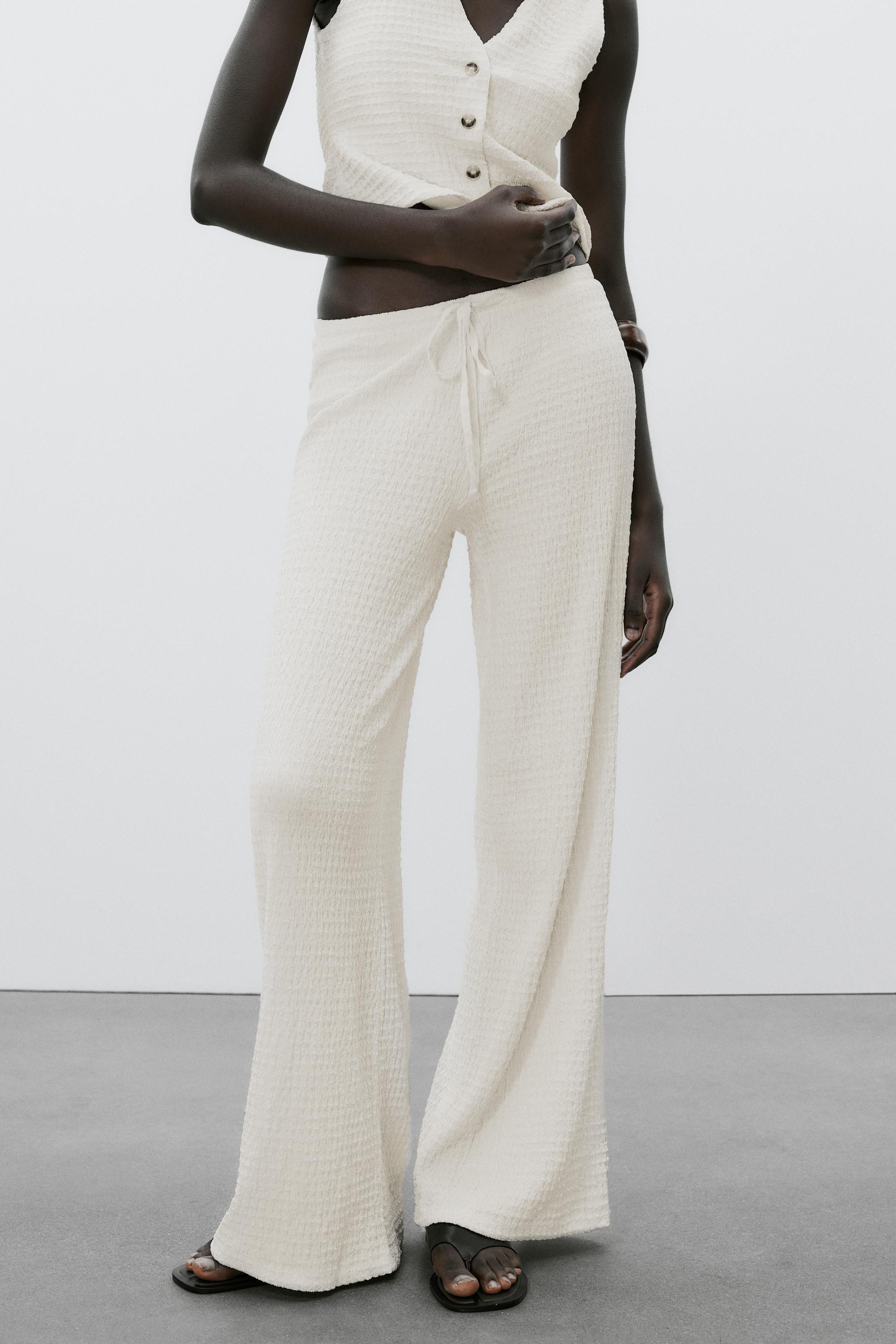 Pants made of structured fabric. High waist with adjustable elastic drawstring waistband. | Zara US