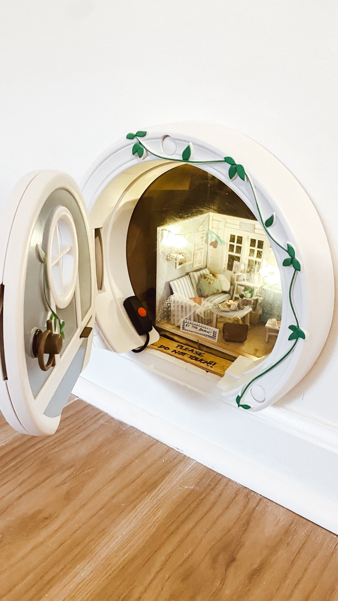 Cute little beach house inside the wall of our beach house.  Cat doors don’t always need to be used for cats! 

#LTKTravel #LTKHome