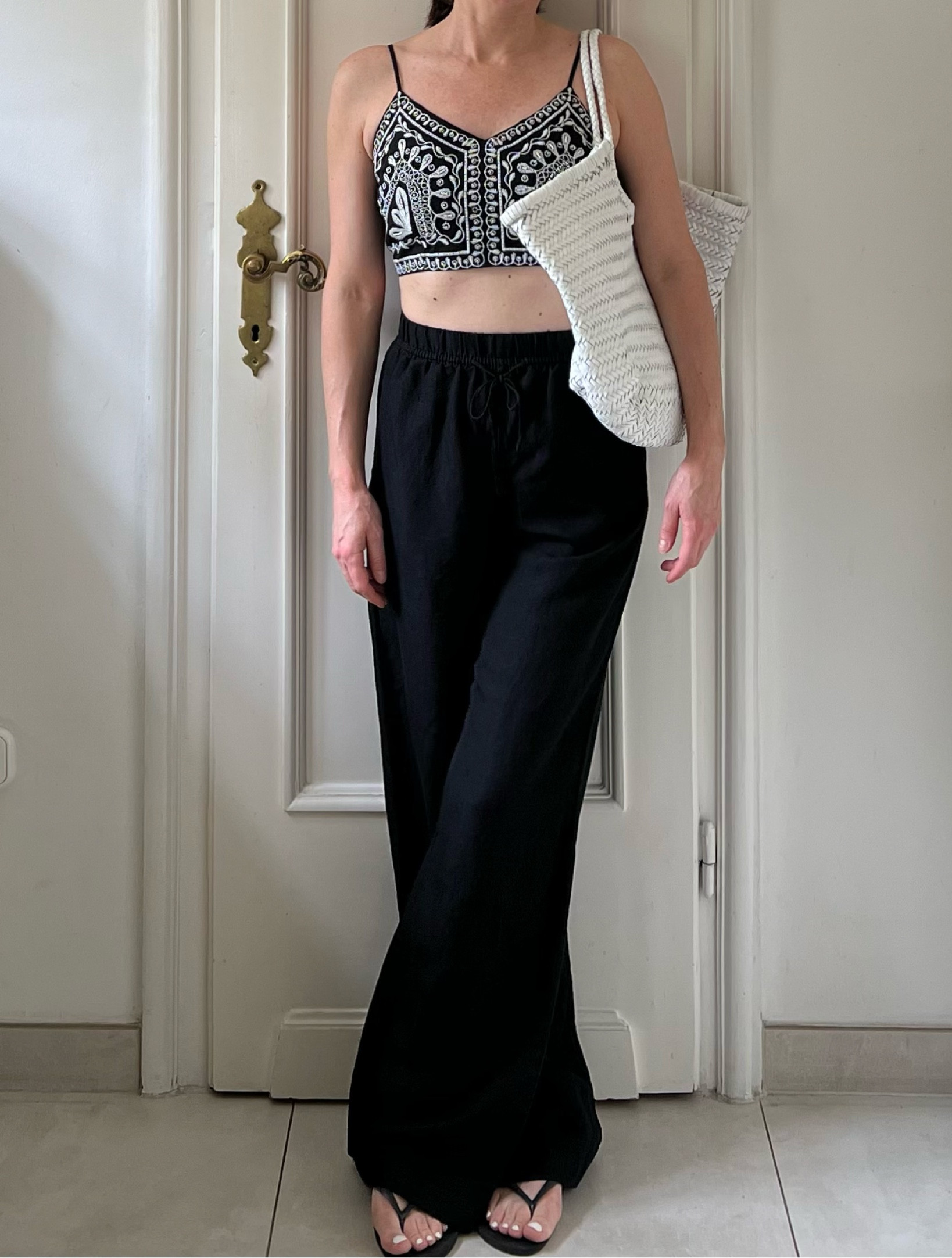 Beade top, embellished top, black top, summer outfit, black trousers outfit, black drawstring trousers, woven leather bag, summer bag, Dragon Diffusion bag, black flip flops, Havaianas flip flops, flip flops outfitts

#LTKbag #LTKsummer #LTKuk