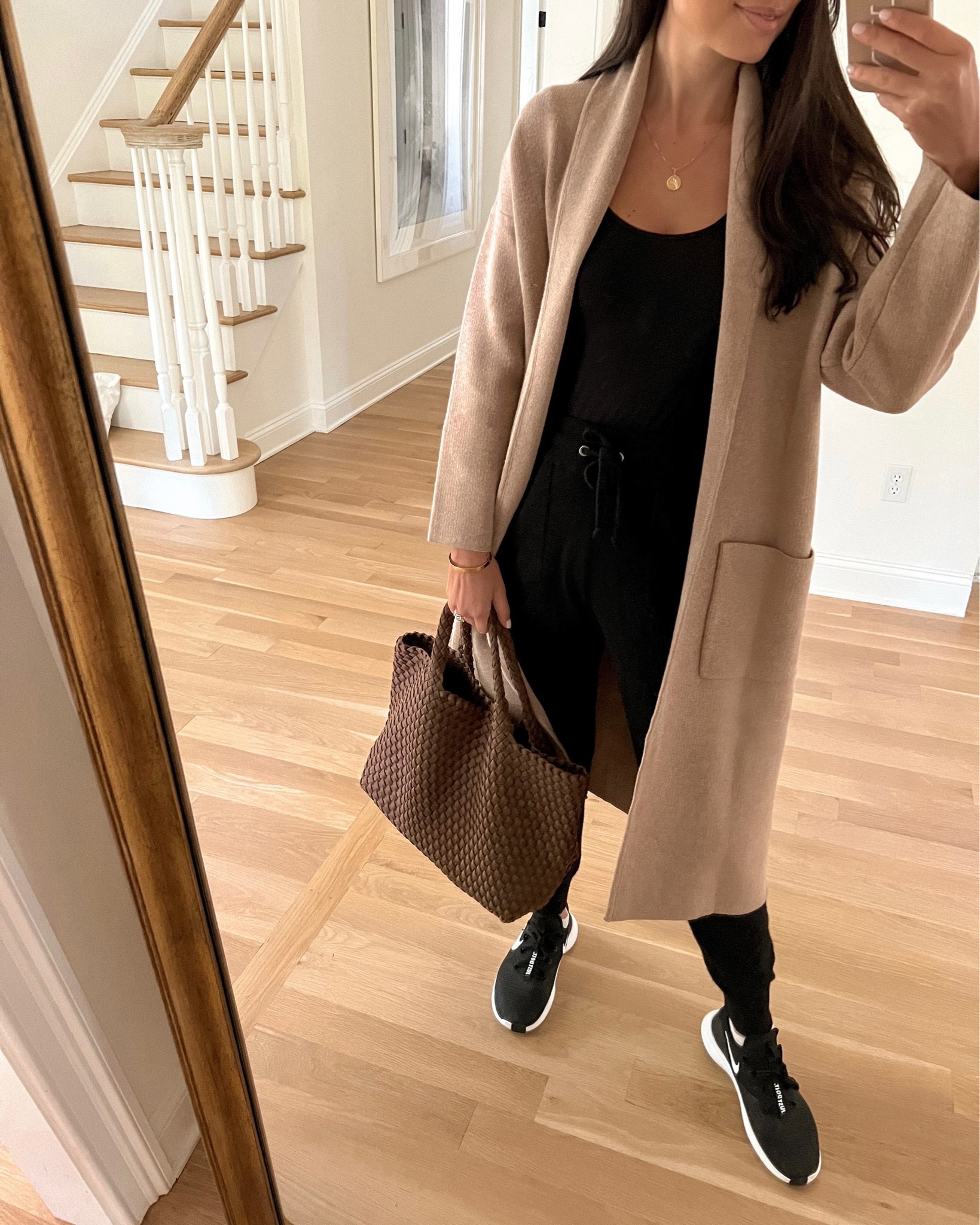 Kat Jamieson of With Love From Kat wears a black bodysuit, camel sweater coatigan, cashmere jogger pants, Nike sneakers and an everyday tote to run errands. Everyday style, casual outfit, fall outfit.

#LTKSeasonal #LTKitbag #LTKstyletip