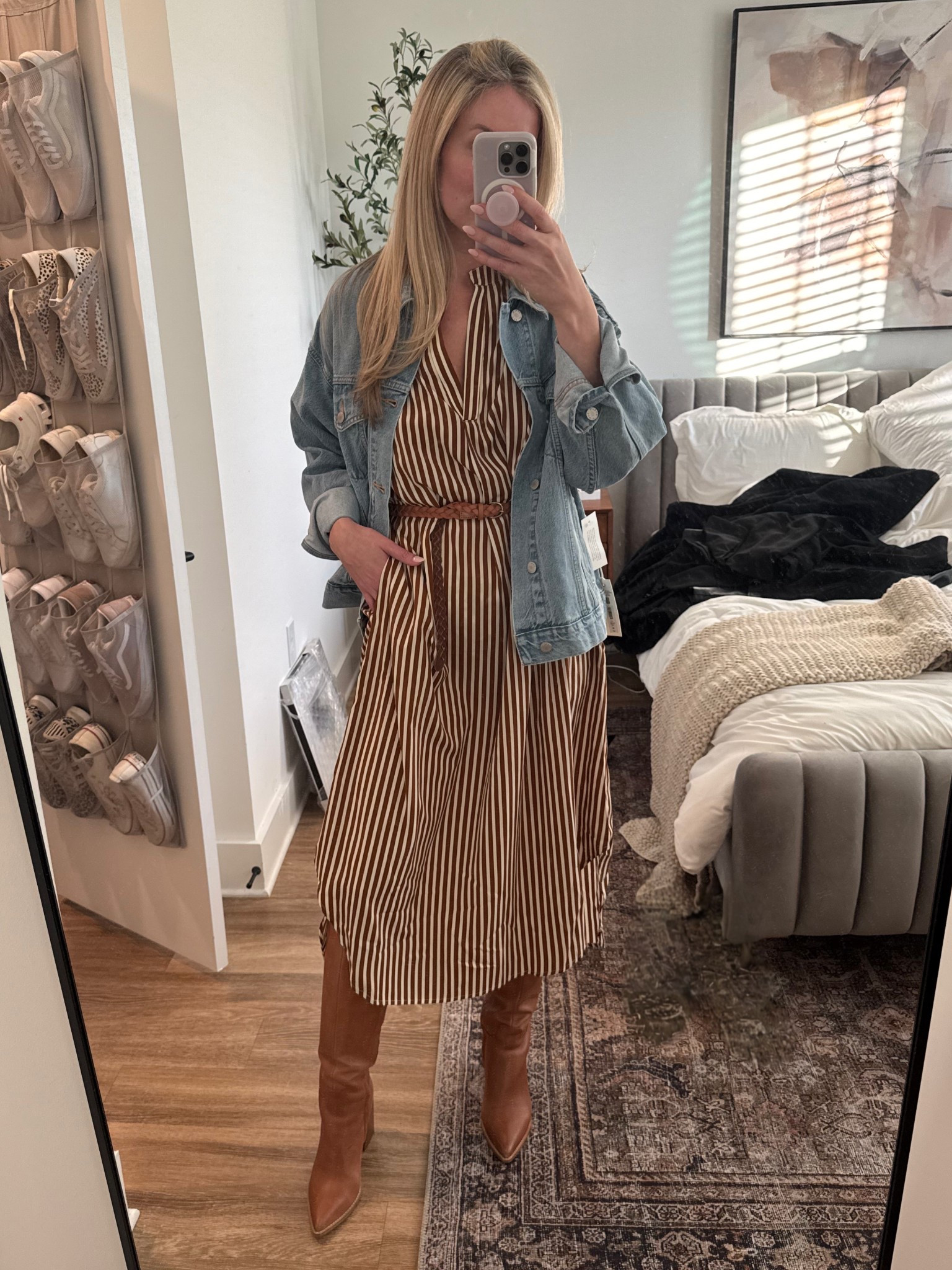 This dress is supposed to be oversized but also runs big, definitely size down! I’m wearing a medium in the denim jacket and boots are TTS 🤎