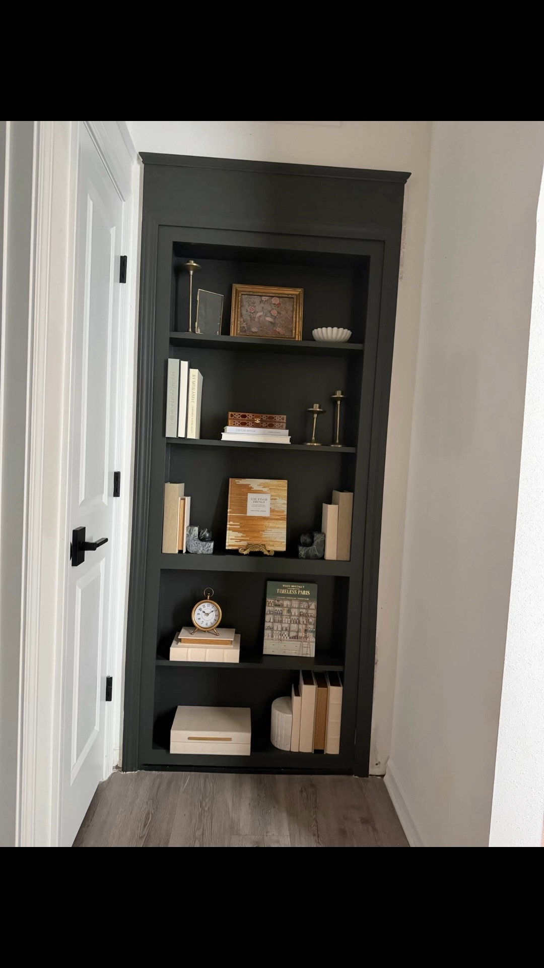 Bookcase hidden door and Parisian decor ￼

#LTKHome #LTKdayinmylife #LTKPlusSize