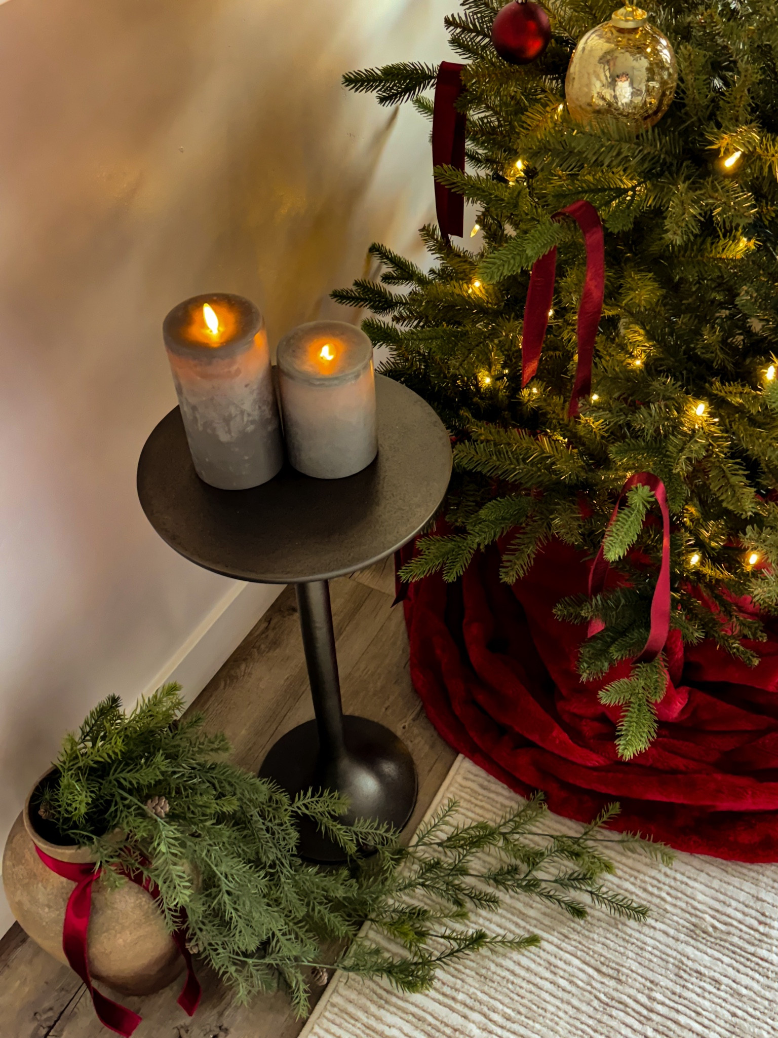 My favorite Christmas corner ♥️🌲 The candles, gold ornaments and the hanging pine bush are from Gatehouse. The vase is from Hobby Lobby. The tree skirt is actually a red faux fur blanket I purchased from home goods. I got a queen size and it worked well. I prefer to use blankets over tree skirts because it gives a more cozy, fluffy, and layered look. 

#christmas

#LTKHoliday #LTKSeasonal #LTKHome