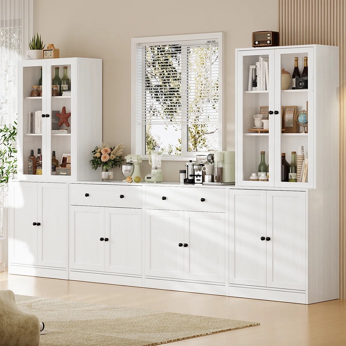 This 71” kitchen pantry with bookcases by Latitude Run from Wayfair is such a smart storage solution. The mix of glass-front upper cabinets, open shelving, and closed lower storage makes it perfect for a coffee bar setup, extra pantry space, or even dining room organization. I love the clean white finish with black hardware for a timeless look.