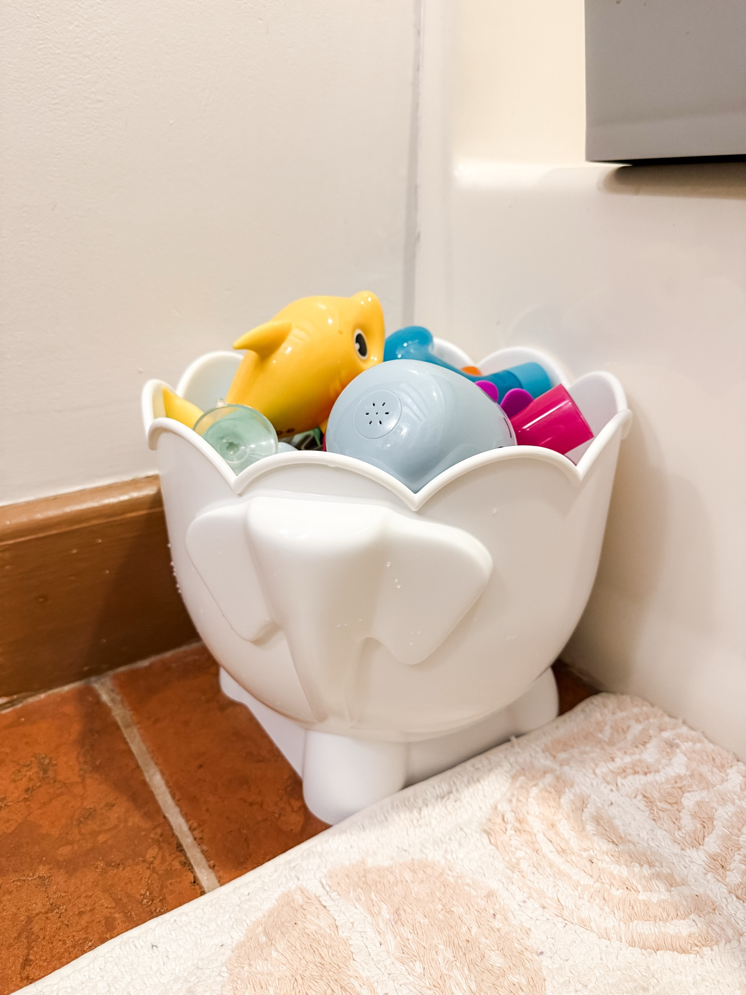 I needed a better system for ALL the bath toys, and this elephant bin delivered. It has great drainage, is easy to clean, and actually looks cute sitting in our bathroom.

#LTKKids #LTKmomlife #LTKHome
