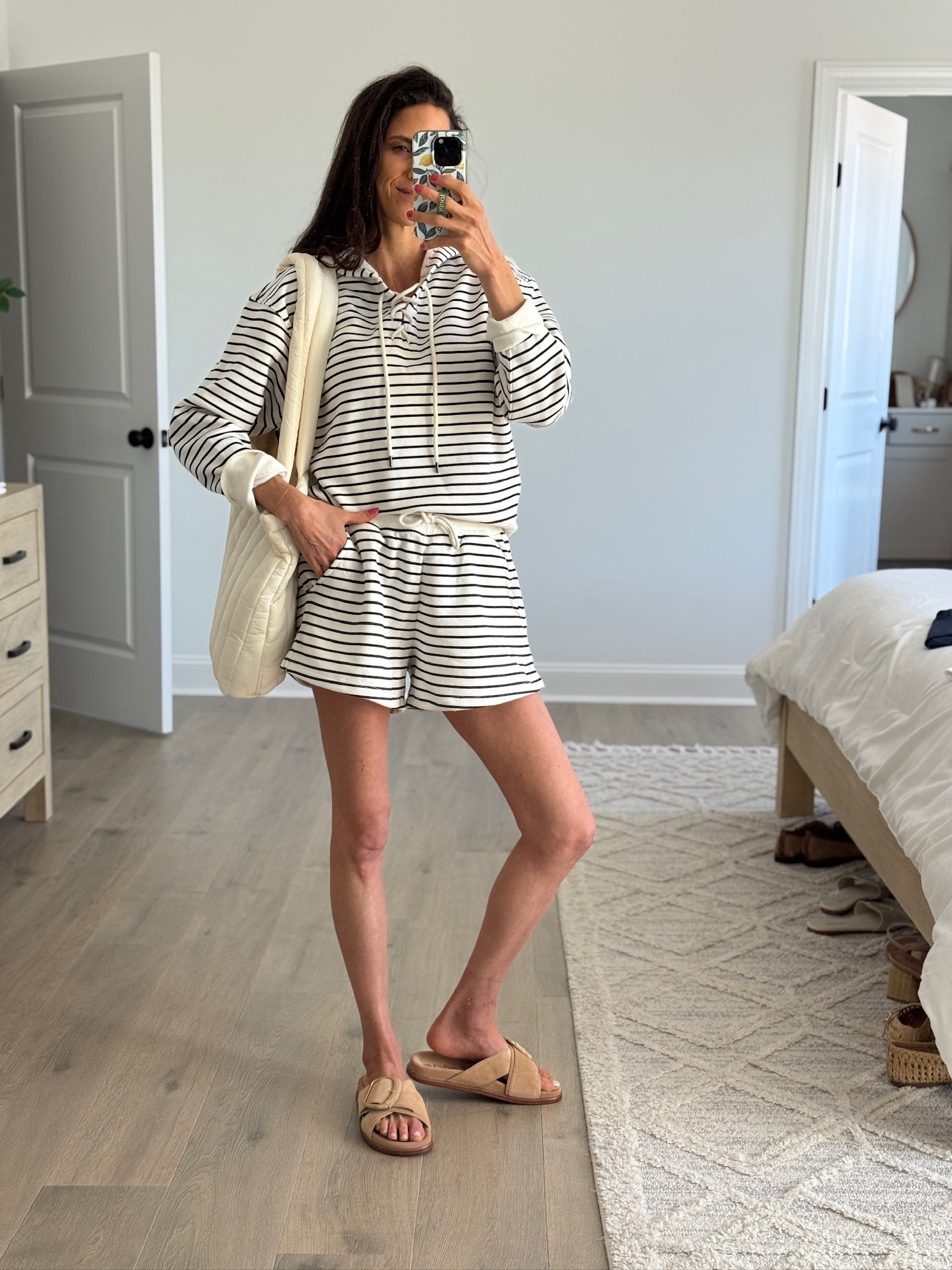 The kind of set you throw on and instantly feel put together without even trying. I’ve been living in this one lately—lightweight, comfy, and perfect for busy days at home or running out the door. Looks cute with sandals now and would be so good with sneakers too.

striped set, casual mom outfit, matching lounge set, comfy everyday style, spring outfit idea, neutral outfit, travel outfit, easy outfit, athleisure look

#LTKmomlife #LTKootd #LTKSeasonal