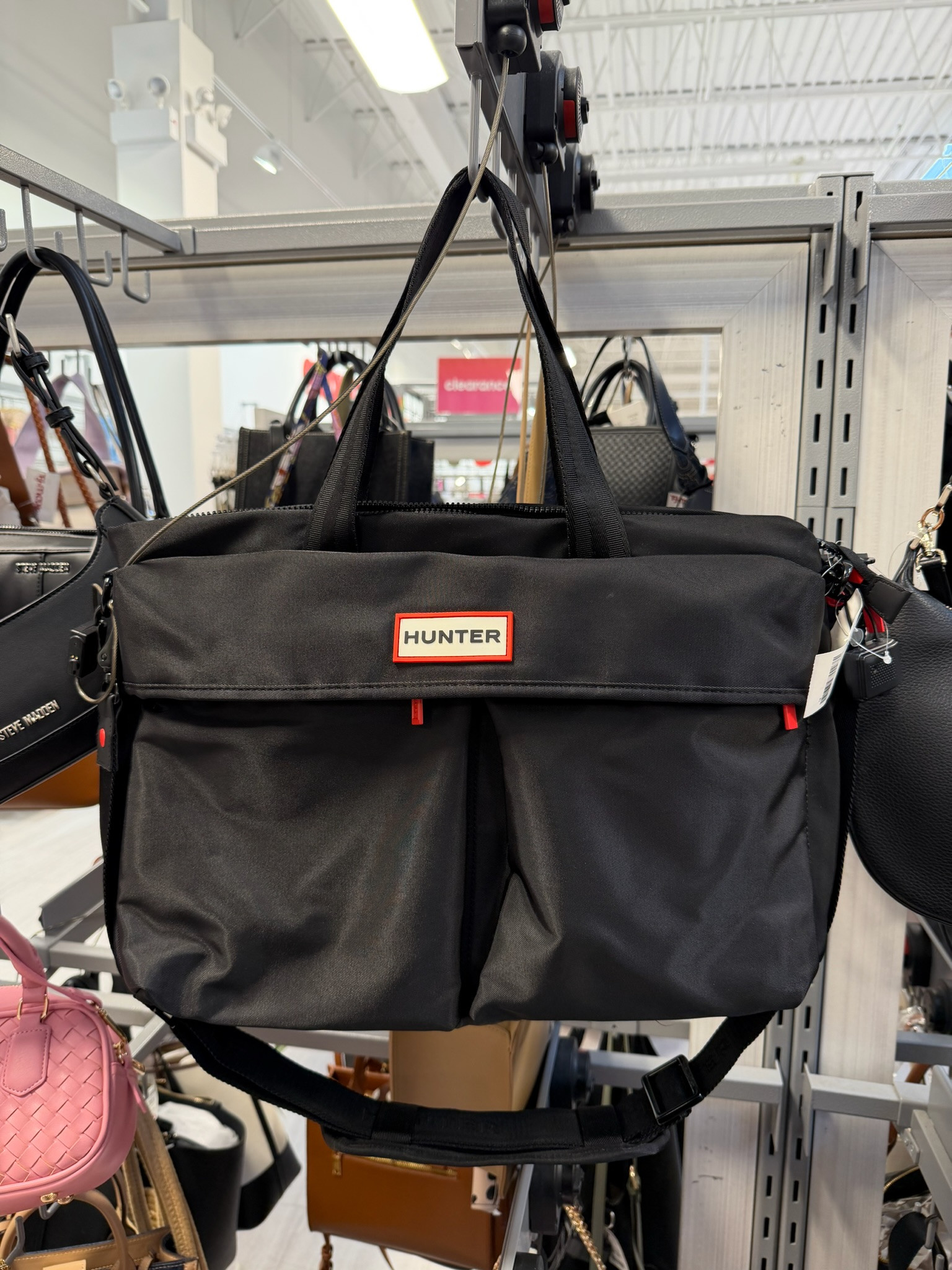 Found a major travel steal today! This Hunter Transport Weekender Duffel is the perfect size for a quick getaway or even as a chic gym bag. I spotted this one in-store at TJ Maxx, but it is also available online right now for a fraction of the original price. It features a water-resistant finish and plenty of room for all your essentials! silver hardware, gallery wall, date night outfits, sunday hoodie, knits and shawls, statement coat, vacation outfits beach, valentines outfit women, valentines day outfit women, work outfits, tj maxx finds, tj maxx haul, hunter bag, weekender bag, travel bag, travel essentials, spring break, designer for less, ltkunder100, ltkunder50, ltkstyle 

 #LTKootd #LTKActive #LTKTravel