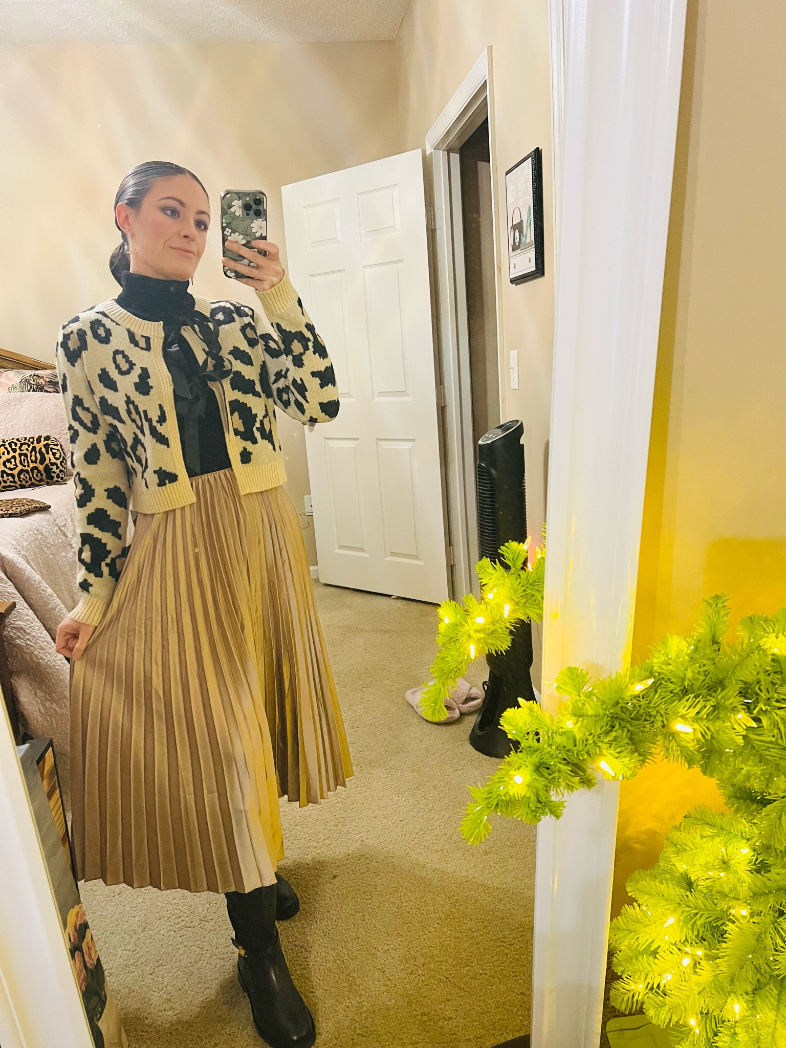 Christmas Eve service ootd. Leopard tie sweater (similar linked, original from Pink Lily) black turtleneck (similar linked, original from WHBM) gold metallic pleated midi skirt (similar linked, original from Lulus) black riding boots (exact linked) 

#LTKGiftGuide #LTKHoliday #LTKFindsUnder100