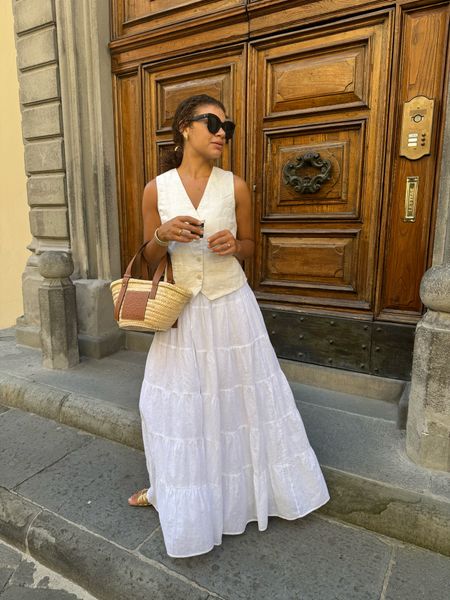 Italy outfit/summer outfit idea. A linen vest looks casual chic with a maxi skirt, sandals, and a straw bag. Add accessories and sunglasses and you’re good to go 😎 (vest is old from Mango and skirt is from Dissh - linking similar)

#LTKSeasonal #LTKStyleTip #LTKTravel