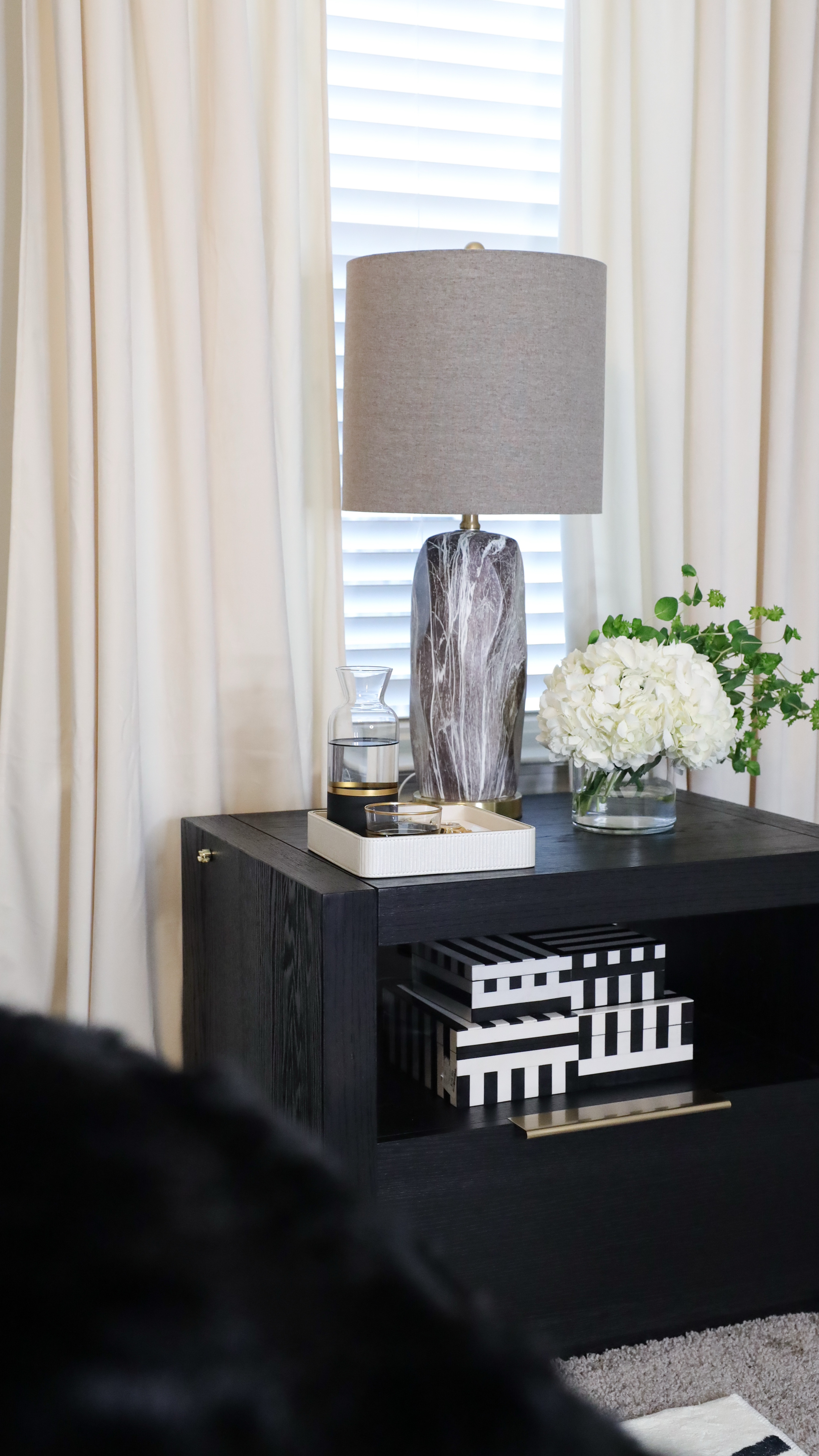 Master bedroom nightstand styling. Open shelving for decor (add boxes for both) and a drawer to house the essentials. Finish it off with a cute lamp, tray and carafe for water 

#LTKHome #LTKMostLoved #LTKWatchNow